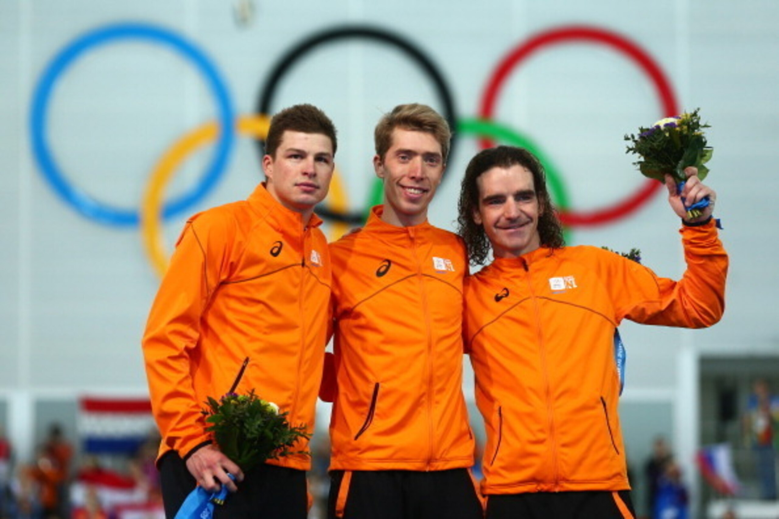 SOCHI, RUSSIA - FEBRUARY 18: (L-R) Silver medalist Sven Kramer of the Netherlands, gold medalist Jorrit Bergsma of the Netherlands and bronze medalist Bob de Jong of the Netherlands celebrate during the flower ceremony for the Men's 10000m Speed Skating e