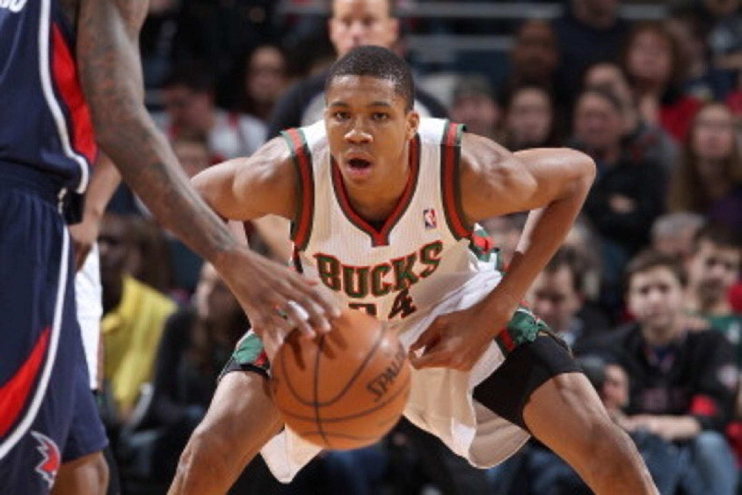 MILWAUKEE, WI - January 25: Giannis Antetokounmpo #34 of the Milwaukee Bucks defends against the Atlanta Hawks on January 25, 2014 at the BMO Harris Bradley Center in Milwaukee, Wisconsin. NOTE TO USER:  User expressly acknowledges and agrees that, by dow