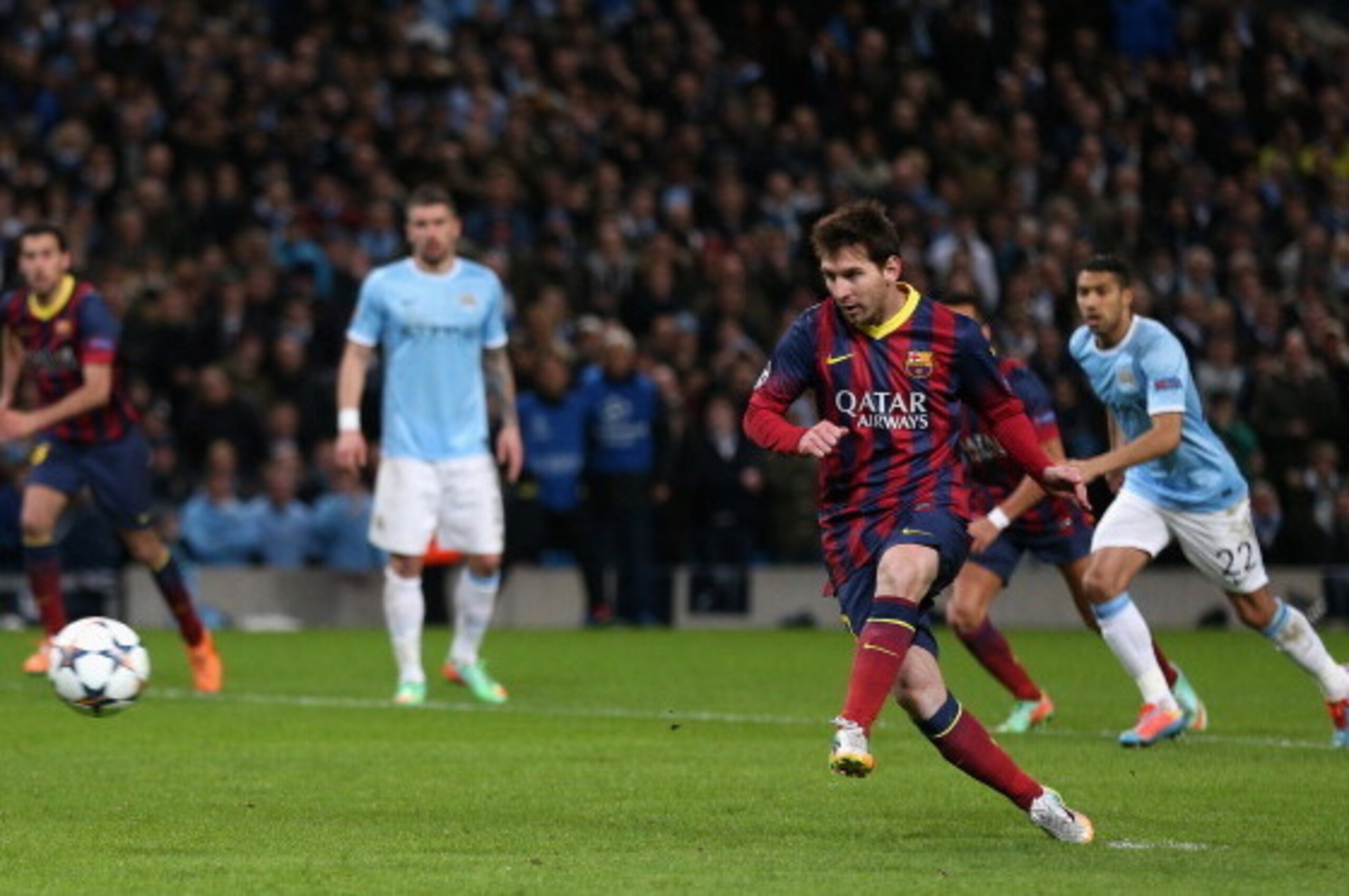 MANCHESTER, ENGLAND - FEBRUARY 18:  Lionel Messi of Barcelona scores the opening goal from a penalty kick during the UEFA Champions League Round of 16 first leg match between Manchester City and Barcelona at the Etihad Stadium on February 18, 2014 in Manc
