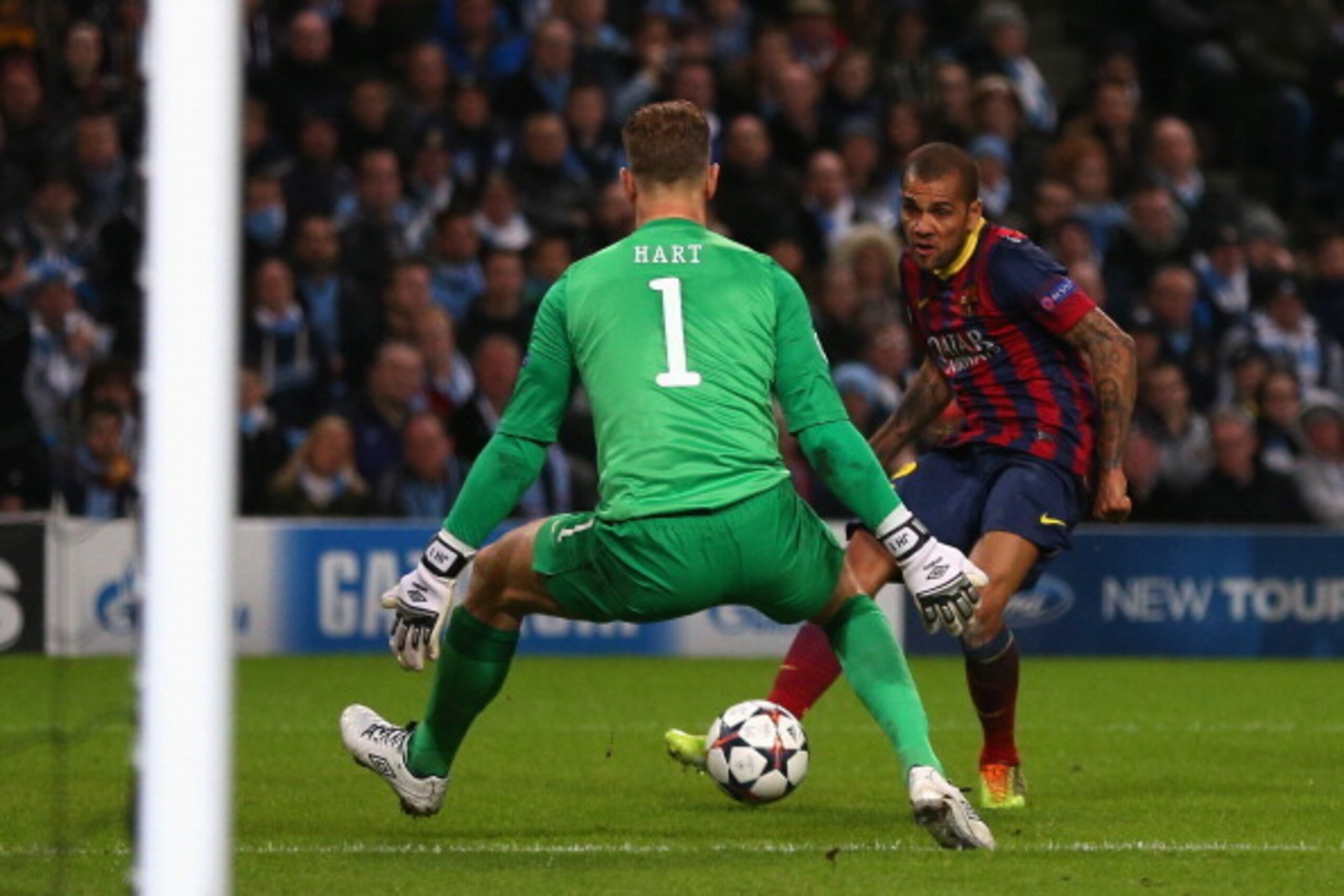 MANCHESTER, ENGLAND - FEBRUARY 18:  Daniel Alves of Barcelona scores his team's second goal during the UEFA Champions League Round of 16 first leg match between Manchester City and Barcelona at the Etihad Stadium on February 18, 2014 in Manchester, Englan