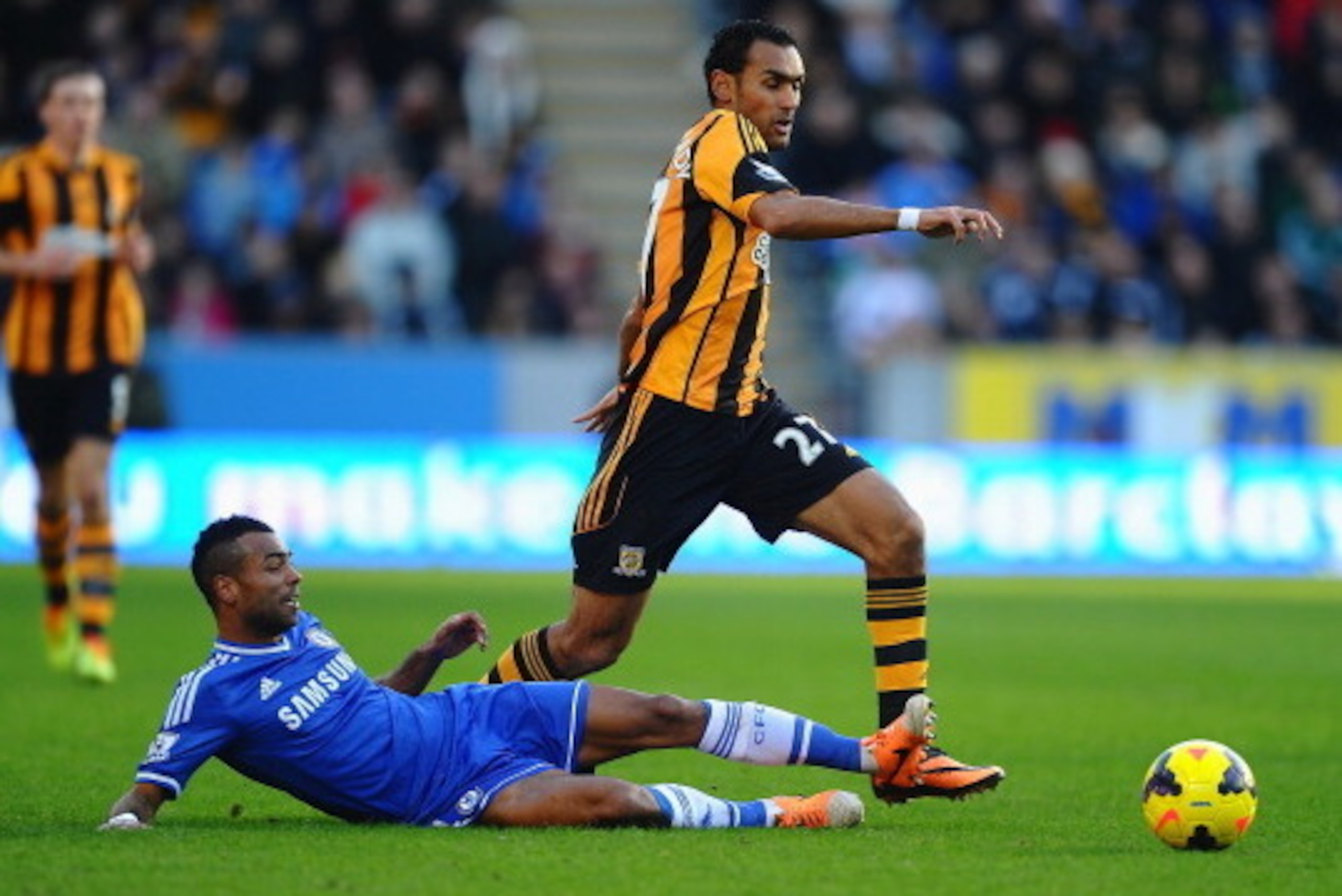 HULL, ENGLAND - JANUARY 11:  Ashley Cole of Chelsea tackles Ahmed Elmohamady of Hull City during the Barclays Premier League match between Hull City and Chelsea at KC Stadium on January 11, 2014 in Hull, England.  (Photo by Laurence Griffiths/Getty Images