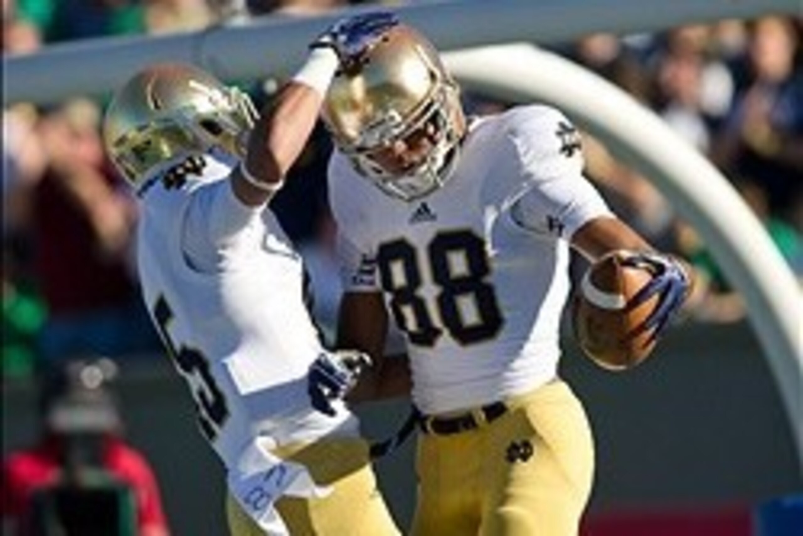 Oct 26, 2013; Colorado Springs, CO, USA; Notre Dame Fighting Irish wide receiver Corey Robinson (88) celebrates with wide receiver William Fuller (15) after scoring a touchdown in the first quarter against the Air Force Falcons at Falcon Stadium. Mandator