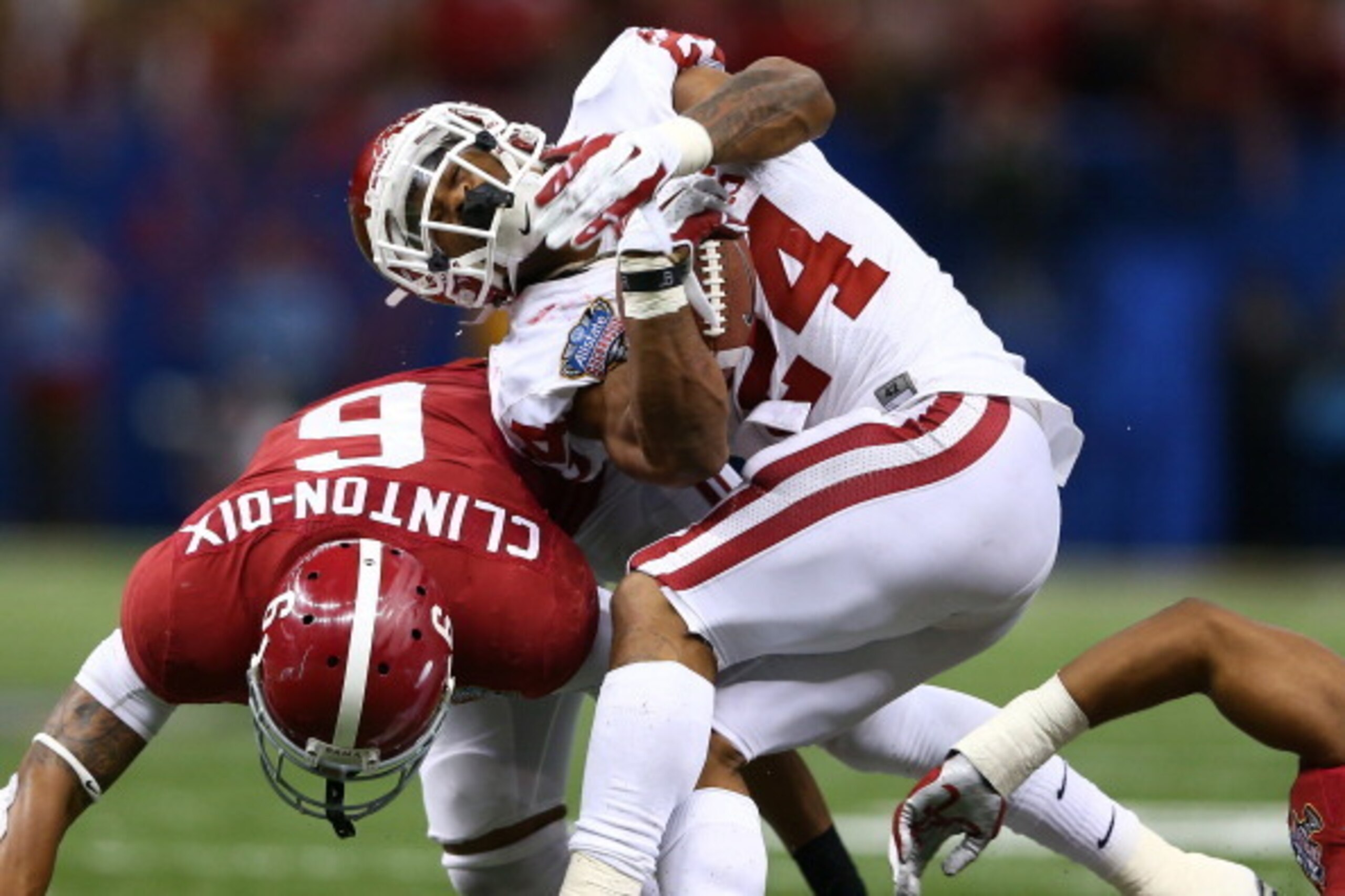 NEW ORLEANS, LA - JANUARY 02:  Brennan Clay #24 of the Oklahoma Sooners is tackled by Ha Ha Clinton-Dix #6 of the Alabama Crimson Tide during the Allstate Sugar Bowl at the Mercedes-Benz Superdome on January 2, 2014 in New Orleans, Louisiana.  (Photo by S