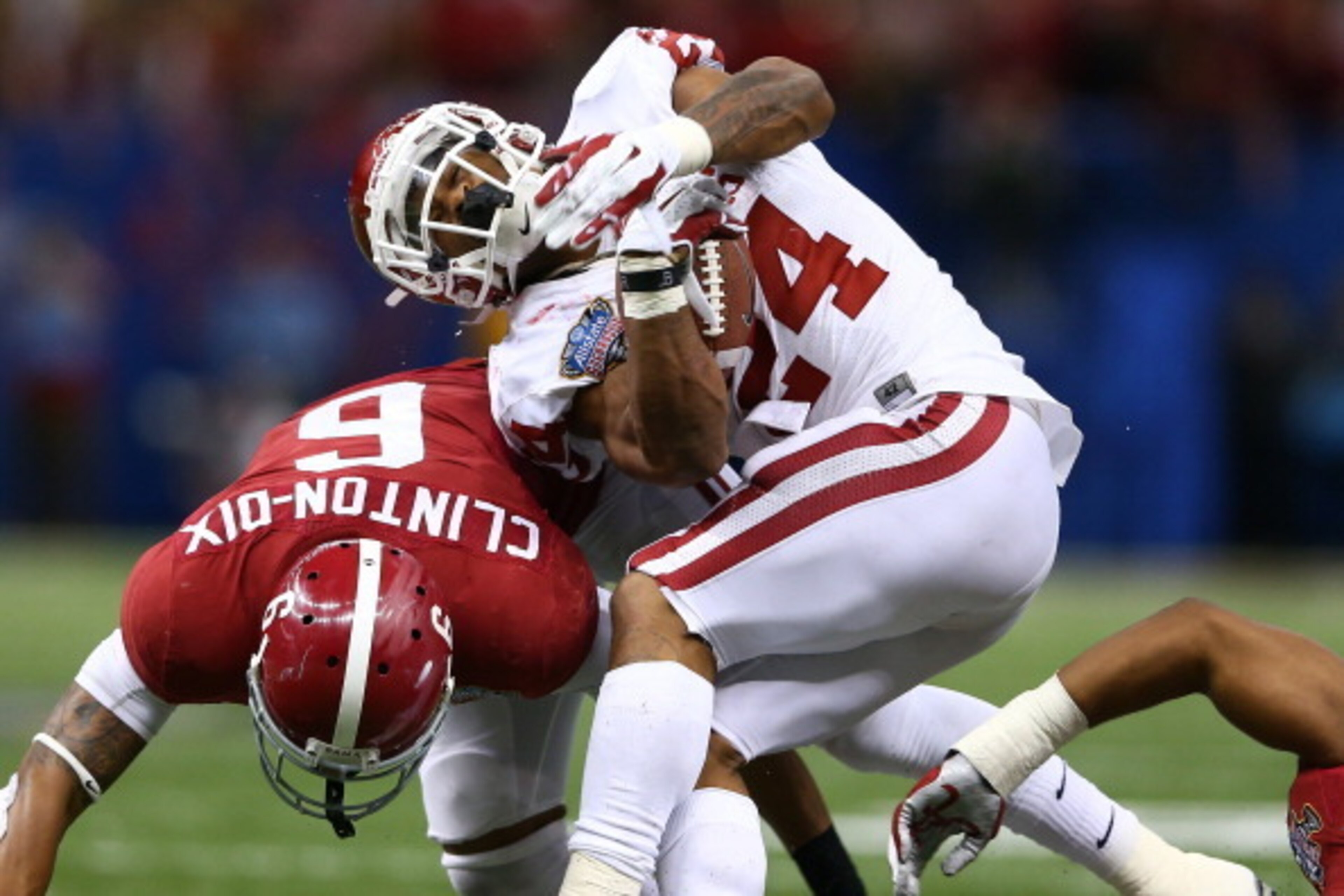 NEW ORLEANS, LA - JANUARY 02:  Brennan Clay #24 of the Oklahoma Sooners is tackled by Ha Ha Clinton-Dix #6 of the Alabama Crimson Tide during the Allstate Sugar Bowl at the Mercedes-Benz Superdome on January 2, 2014 in New Orleans, Louisiana.  (Photo by S