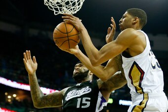 Jan 21, 2014; New Orleans, LA, USA; New Orleans Pelicans power forward Anthony Davis (23) and Sacramento Kings center DeMarcus Cousins (15) fight for possession of the ball during the first quarter of a game at New Orleans Arena. Mandatory Credit: Derick
