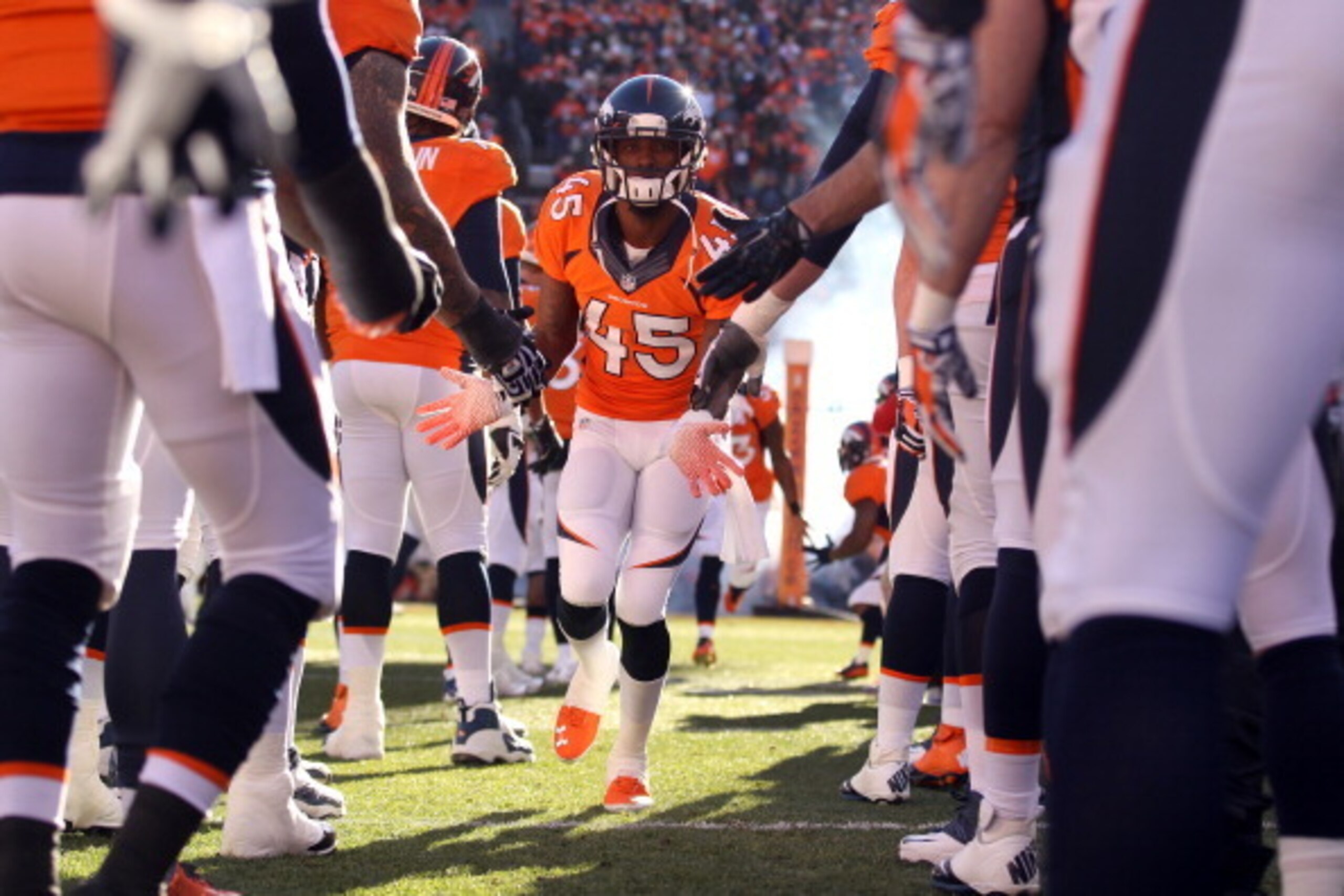 DENVER, CO - JANUARY 12:   Dominique Rodgers-Cromartie #45 of the Denver Broncos runs on the field prior to their AFC Divisional Playoff Game against the San Diego Chargers at Sports Authority Field at Mile High on January 12, 2014 in Denver, Colorado.  (