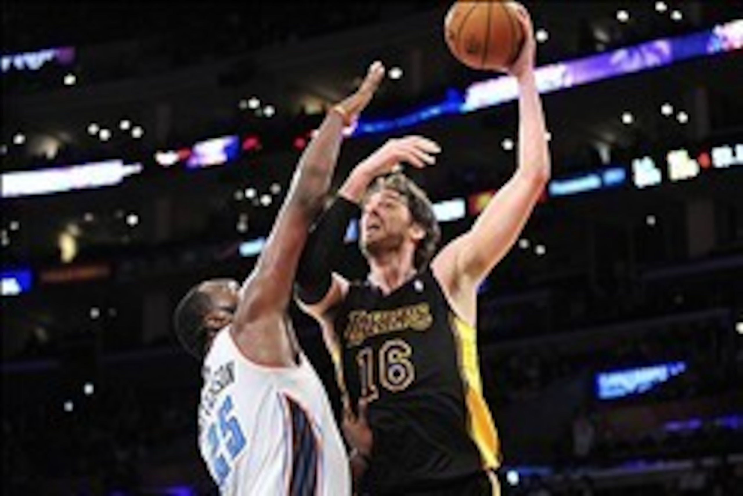January 31, 2014; Los Angeles, CA, USA; Los Angeles Lakers center Pau Gasol (16) shoots a basket against the defense of Charlotte Bobcats center Al Jefferson (25) during the second half at Staples Center. Mandatory Credit: Gary A. Vasquez-USA TODAY Sports