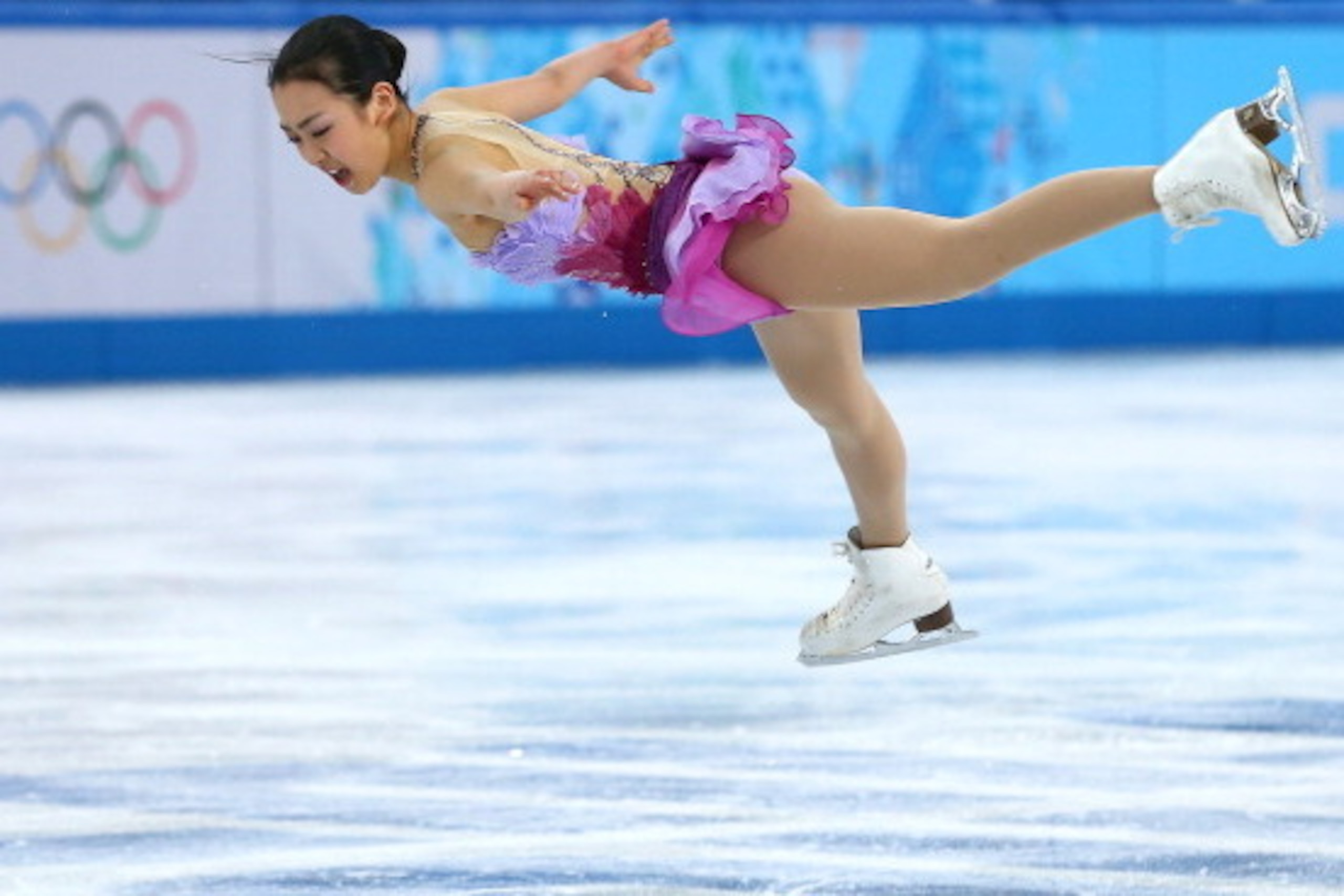 SOCHI, RUSSIA - FEBRUARY 08:  Mao Asada of Japan competes in the Figure Skating Team Ladies Short Program during day one of the Sochi 2014 Winter Olympics at Iceberg Skating Palace on February 8, 2014 in Sochi, Russia.  (Photo by Streeter Lecka/Getty Imag