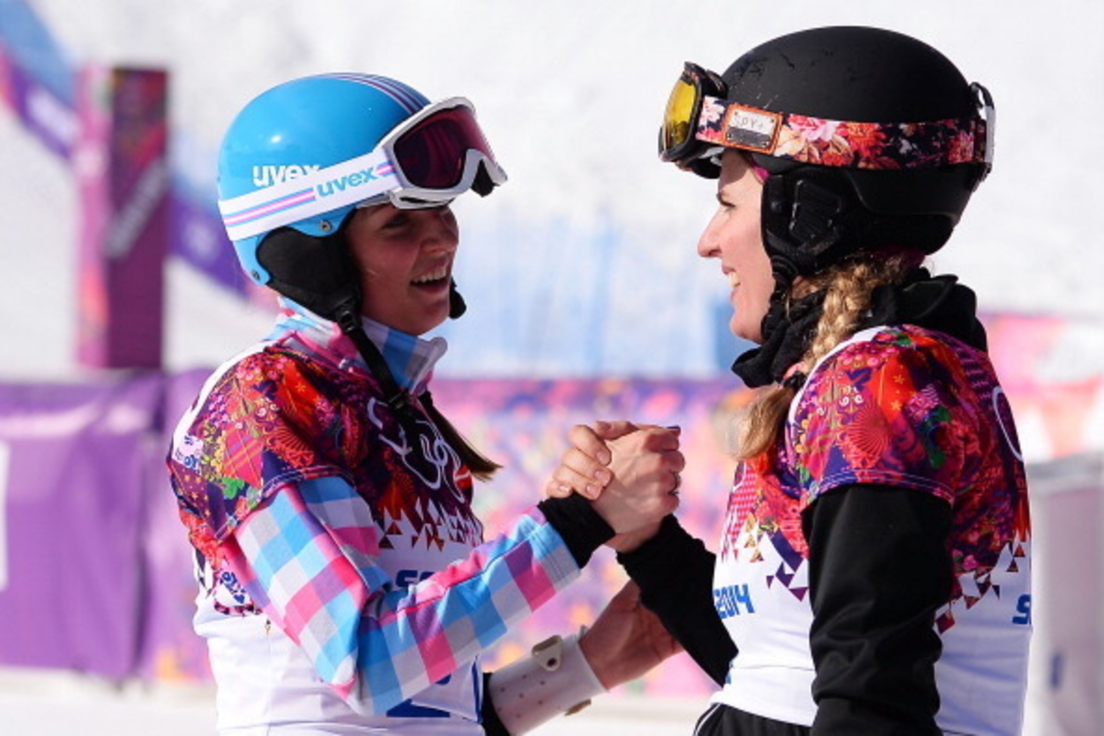 SOCHI, RUSSIA - FEBRUARY 19: Alena Zavarzina of Russia (L) and Patrizia Kummer of Switzerland celebrate winning the bronze and gold medals in the Snowboard Ladies' Parallel Giant Slalom Finals on day twelve of the 2014 Winter Olympics at Rosa Khutor Ext SOCHI, RUSSIA - FEBRUARY 19: Alena Zavarzina of Russia (L) and Patrizia Kummer of Switzerland celebrate winning the bronze and gold medals in the Snowboard Ladies' Parallel Giant Slalom Finals on day twelve of the 2014 Winter Olympics at Rosa Khutor Ext