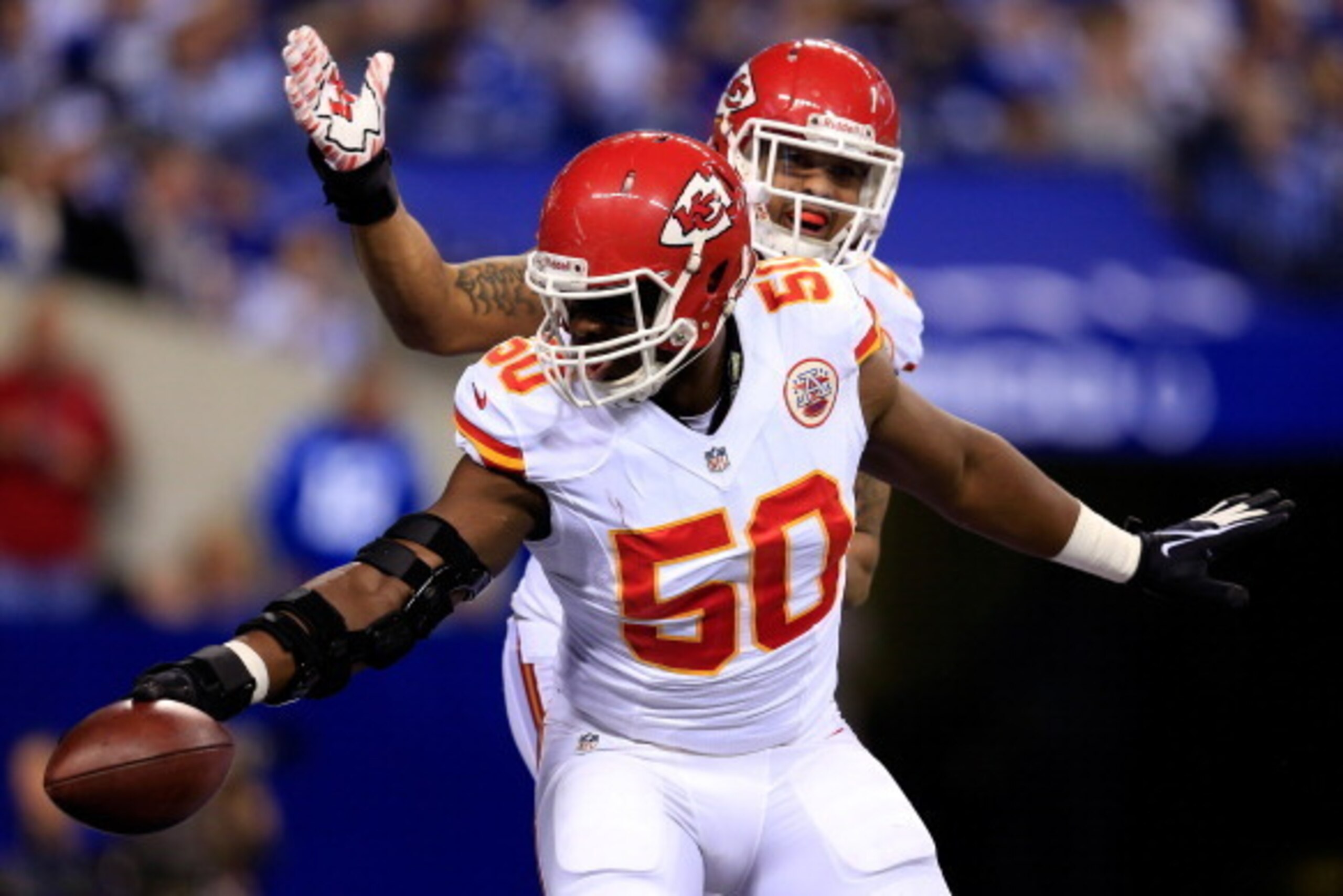 INDIANAPOLIS, IN - JANUARY 04: Outside linebacker Justin Houston #50 of the Kansas City Chiefs celebrates against the Indianapolis Colts during a Wild Card Playoff game at Lucas Oil Stadium on January 4, 2014 in Indianapolis, Indiana.  (Photo by Rob Carr/