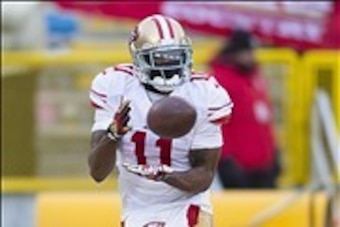 Jan 5, 2014; Green Bay, WI, USA; San Francisco 49ers wide receiver Quinton Patton (11) catches the ball prior to the 2013 NFC wild card playoff football game against the Green Bay Packers at Lambeau Field. Mandatory Credit: Jeff Hanisch-USA TODAY Sports