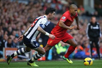 LIVERPOOL, ENGLAND - OCTOBER 26:  Glen Johnson of Liverpool competes with Liam Ridgewell of West Bromwich Albion during the Barclays Premier League match between Liverpool and West Bromwich Albion at Anfield on October 26, 2013 in Liverpool, England.  (Ph