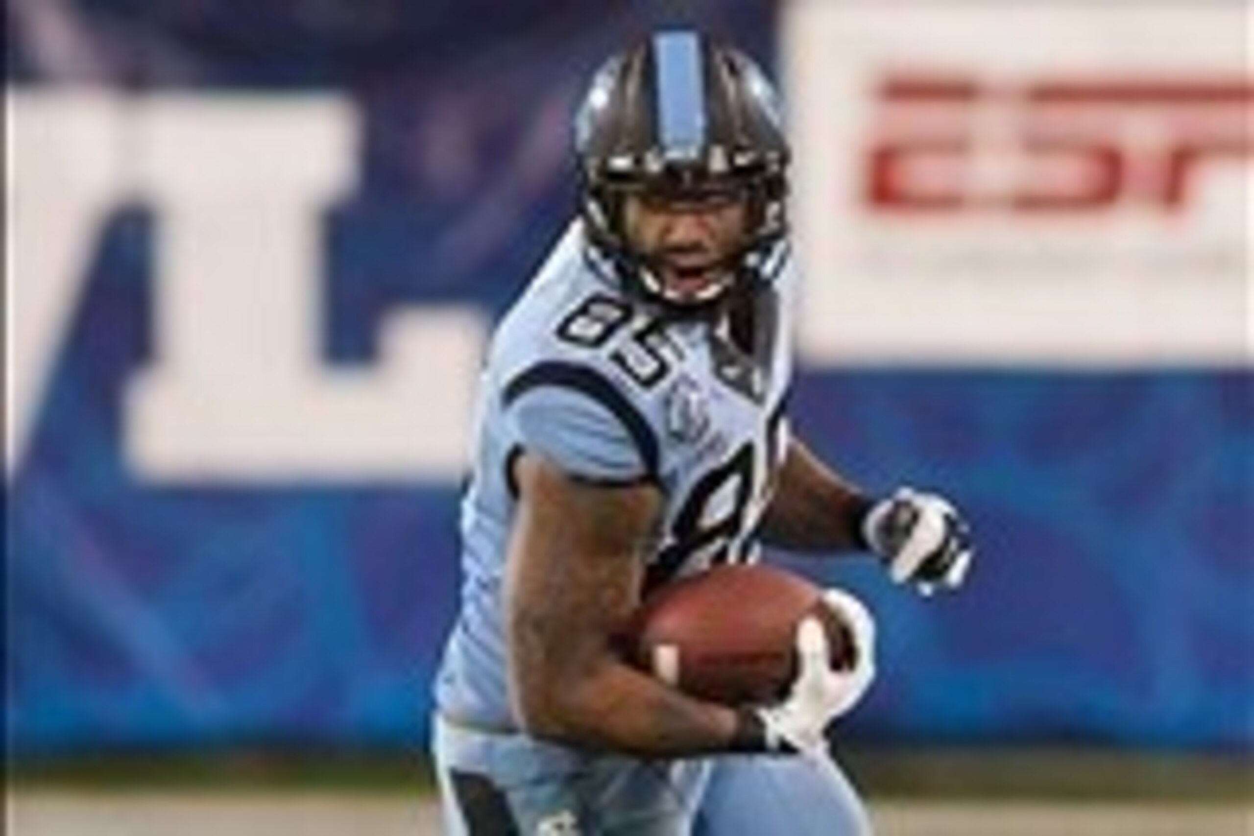 Dec 28, 2013; Charlotte, NC, USA; North Carolina Tar Heels tight end Eric Ebron (85) runs after a catch during the third quarter against the Cincinnati Bearcats in the Belk Bowl at Bank of America Stadium. Carolina defeated Cincinnati 39-17. Mandatory Cre
