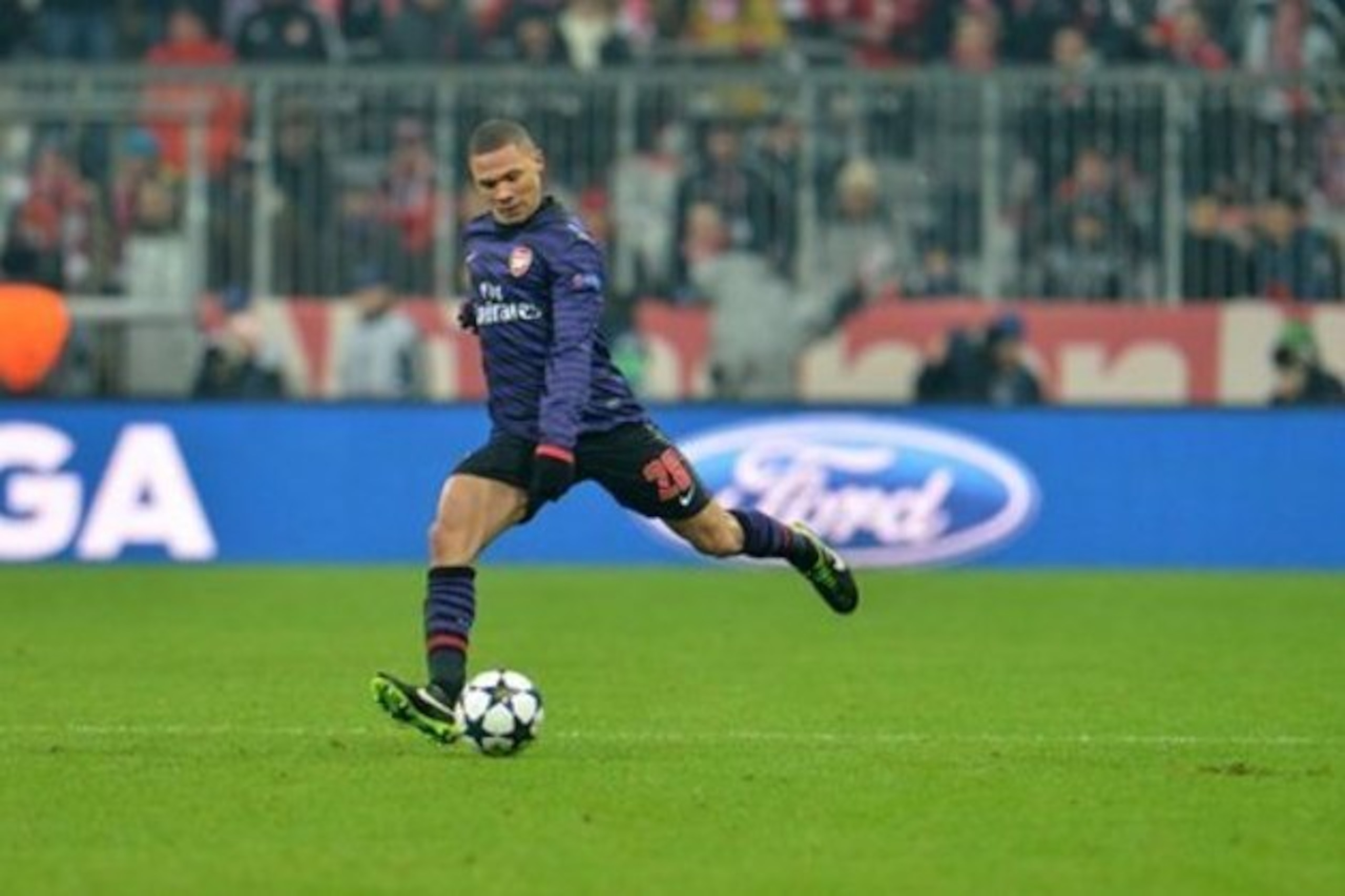 Kieran Gibbs plays in a ball during last year's second leg.
