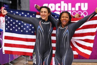 SOCHI, RUSSIA - FEBRUARY 19:  Silver medallists Elana Meyers (L) and Lauryn Williams of the United States team 1 pose during the Women's Bobsleigh on Day 12 of the Sochi 2014 Winter Olympics at Sliding Center Sanki on February 19, 2014 in Sochi, Russia.  