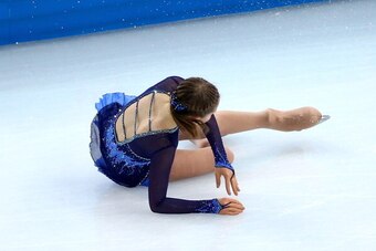 SOCHI, RUSSIA - FEBRUARY 19:  Yulia Lipnitskaya of Russia falls while competing in the Figure Skating Ladies' Short Program on day 12 of the Sochi 2014 Winter Olympics at Iceberg Skating Palace on February 19, 2014 in Sochi, Russia.  (Photo by Ryan Pierse