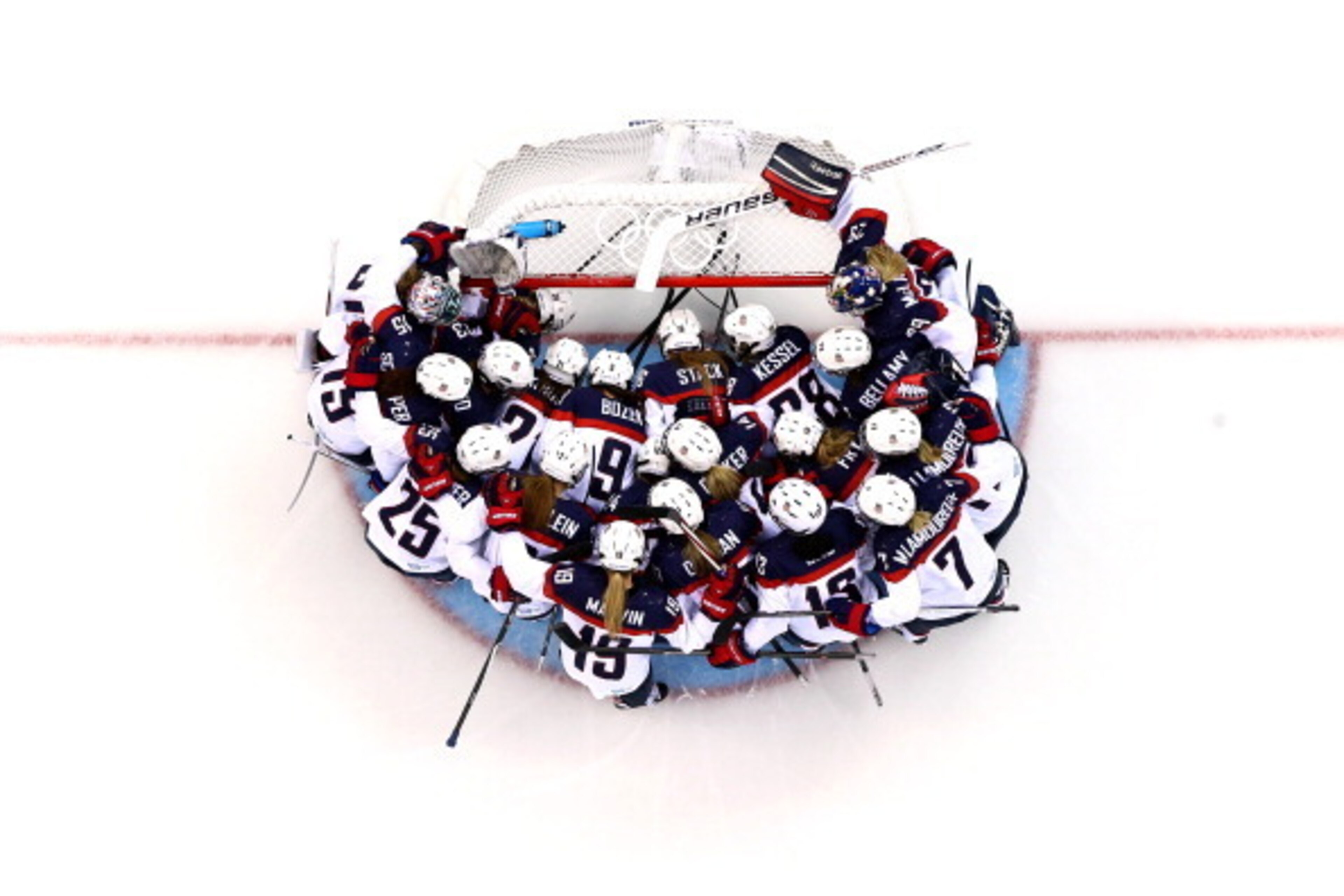 SOCHI, RUSSIA - FEBRUARY 12: The United States team huddles around the net prior to the Women's Ice Hockey Preliminary Round Group A game against the Canada on day five of the Sochi 2014 Winter Olympics at Shayba Arena on February 12, 2014 in Sochi, Russi