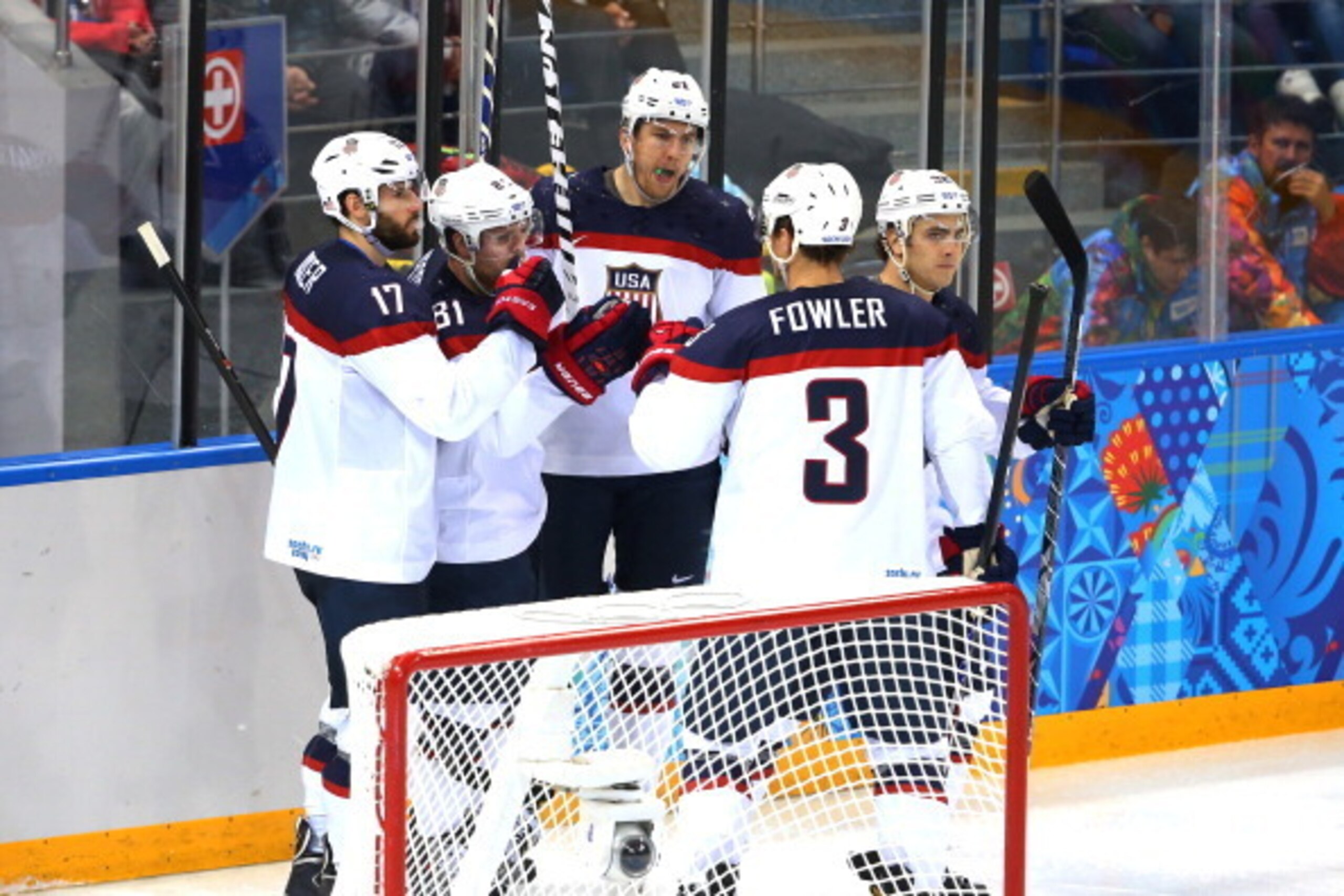 SOCHI, RUSSIA - FEBRUARY 19:  Phil Kessel #81 (2nd L) of the United States celebrates with teammates after scoring his team's fifth goal against Alexander Salak #53 of the Czech Republic in the third period during the Men's Ice Hockey Quarterfinal Playoff