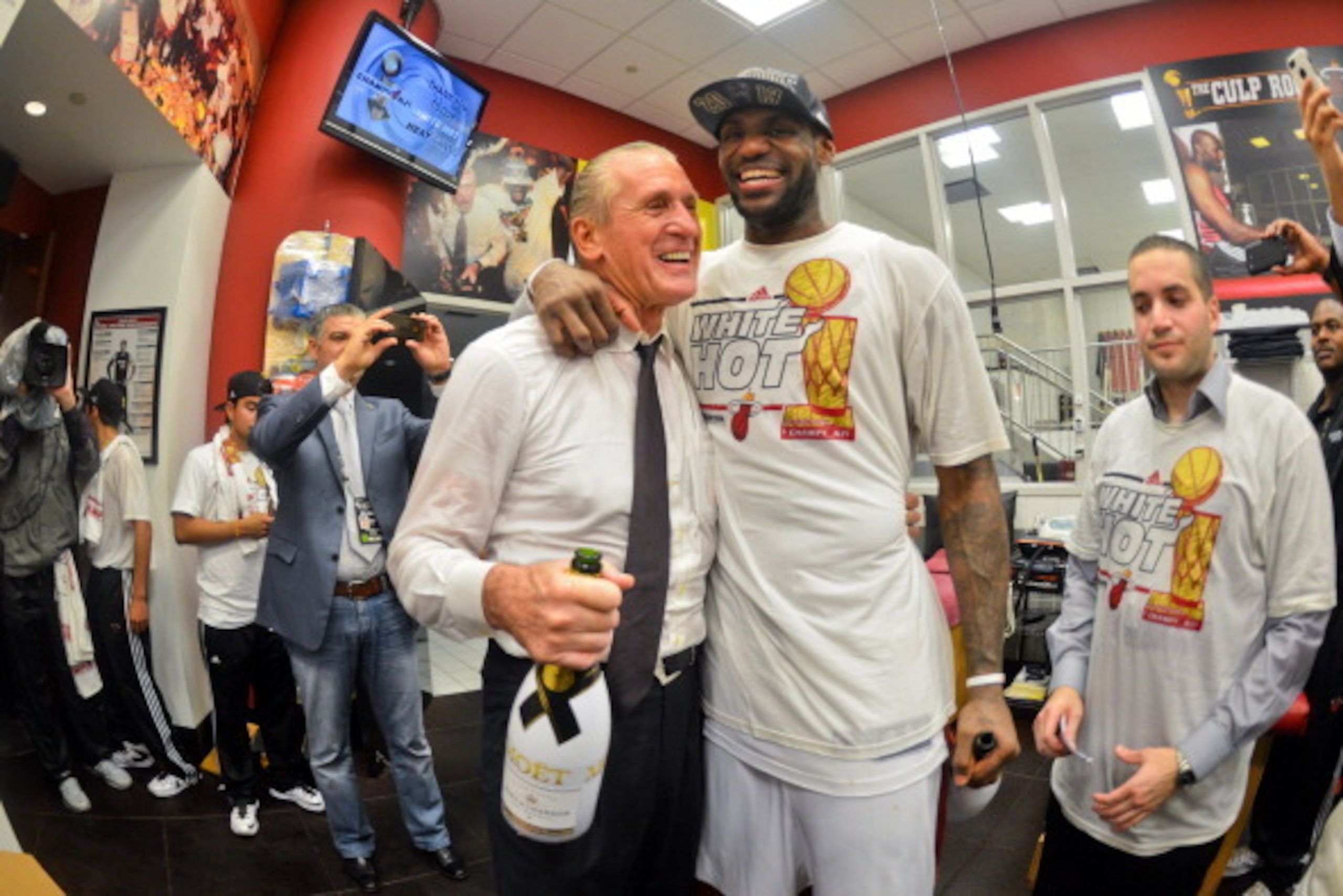 MIAMI, FL - JUNE 20: LeBron James #6 of the Miami Heat celebrates with team President Pat Riley in the locker room following the Heat's victory against the San Antonio Spurs in Game Seven of the 2013 NBA Finals on June 20, 2013 at American Airlines Arena 