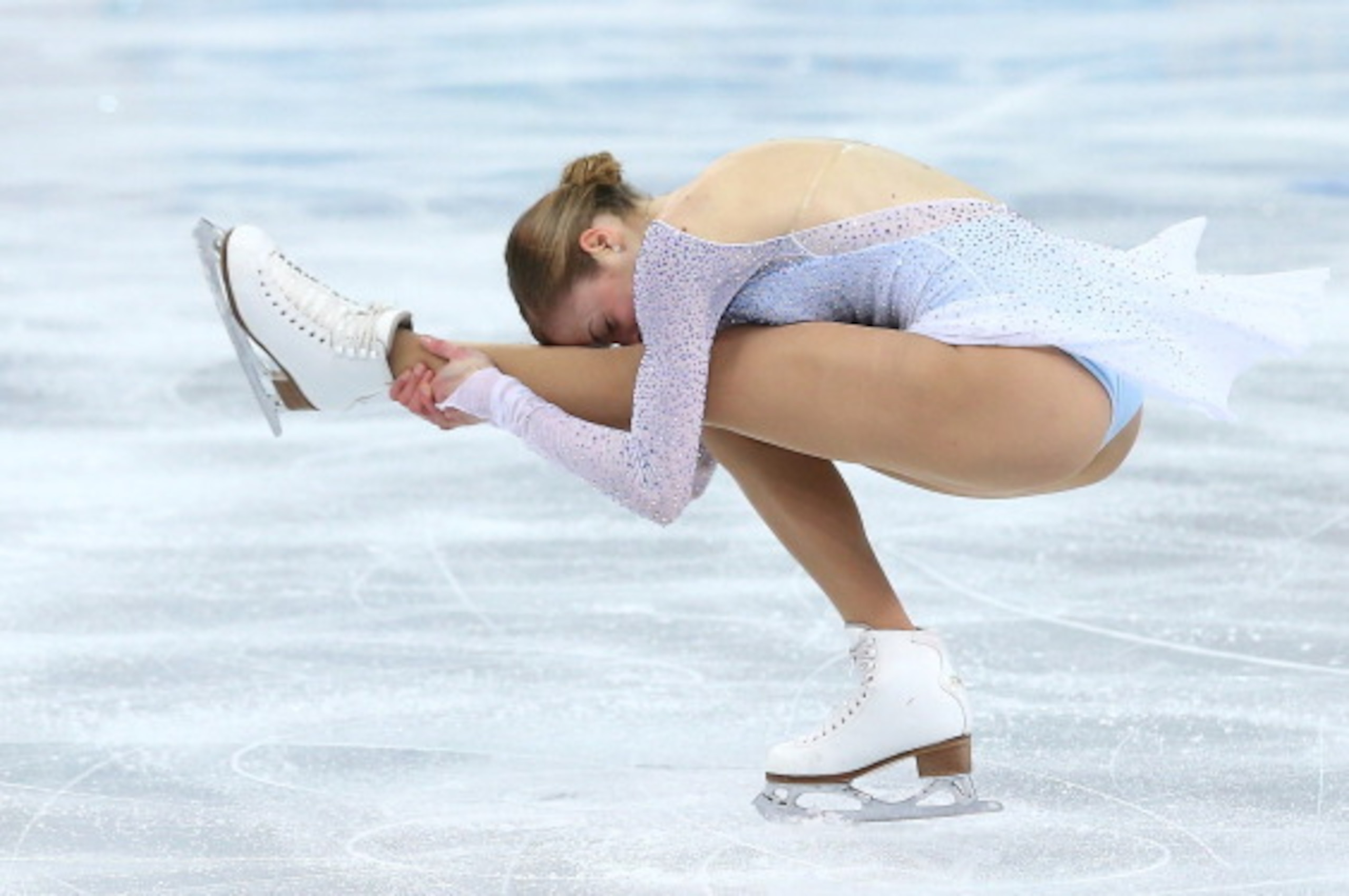 SOCHI, RUSSIA - FEBRUARY 08:  Carolina Kostner of Italy competes in the Figure Skating Team Ladies Short Program during day one of the Sochi 2014 Winter Olympics at Iceberg Skating Palace on February 8, 2014 in Sochi, Russia.  (Photo by Streeter Lecka/Get