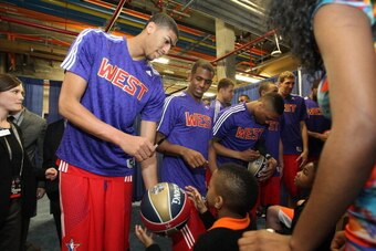 NEW ORLEANS, LA - FEBRUARY 16: Anthony Davis #23 of the Western Conference All-Stars signs an autograph for a fan before the 2014 NBA All-Star Game at Smoothie King Center on February 16, 2014 in New Orleans, Louisiana. NOTE TO USER: User expressly acknow