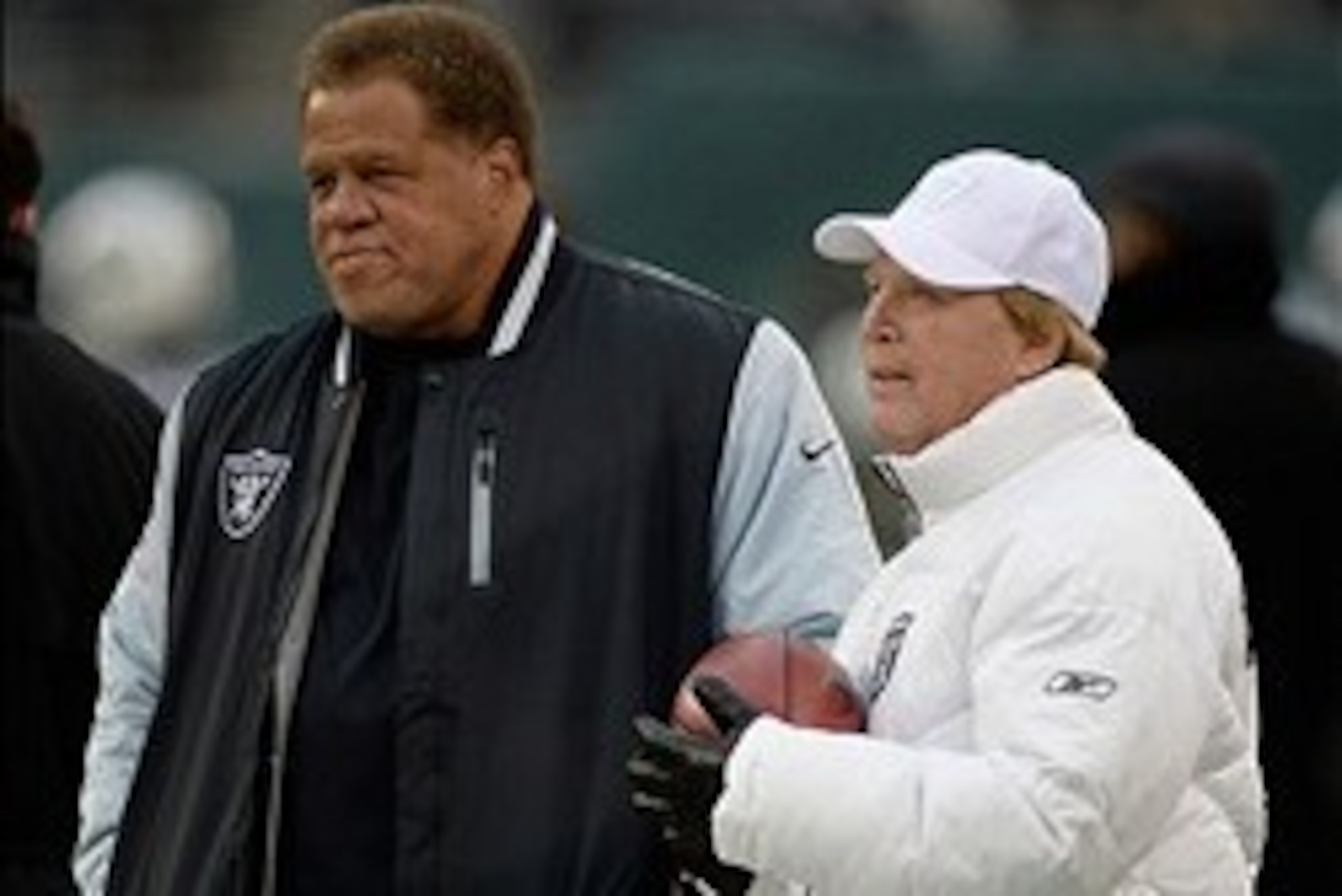 Dec 8, 2013; East Rutherford, NJ, USA; Oakland Raiders general manager Reggie McKenzie and owner Mark Davis on the field before the game against the New York Jets at MetLife Stadium. Mandatory Credit: Robert Deutsch-USA TODAY Sports Dec 8, 2013; East Rutherford, NJ, USA; Oakland Raiders general manager Reggie McKenzie and owner Mark Davis on the field before the game against the New York Jets at MetLife Stadium. Mandatory Credit: Robert Deutsch-USA TODAY Sports