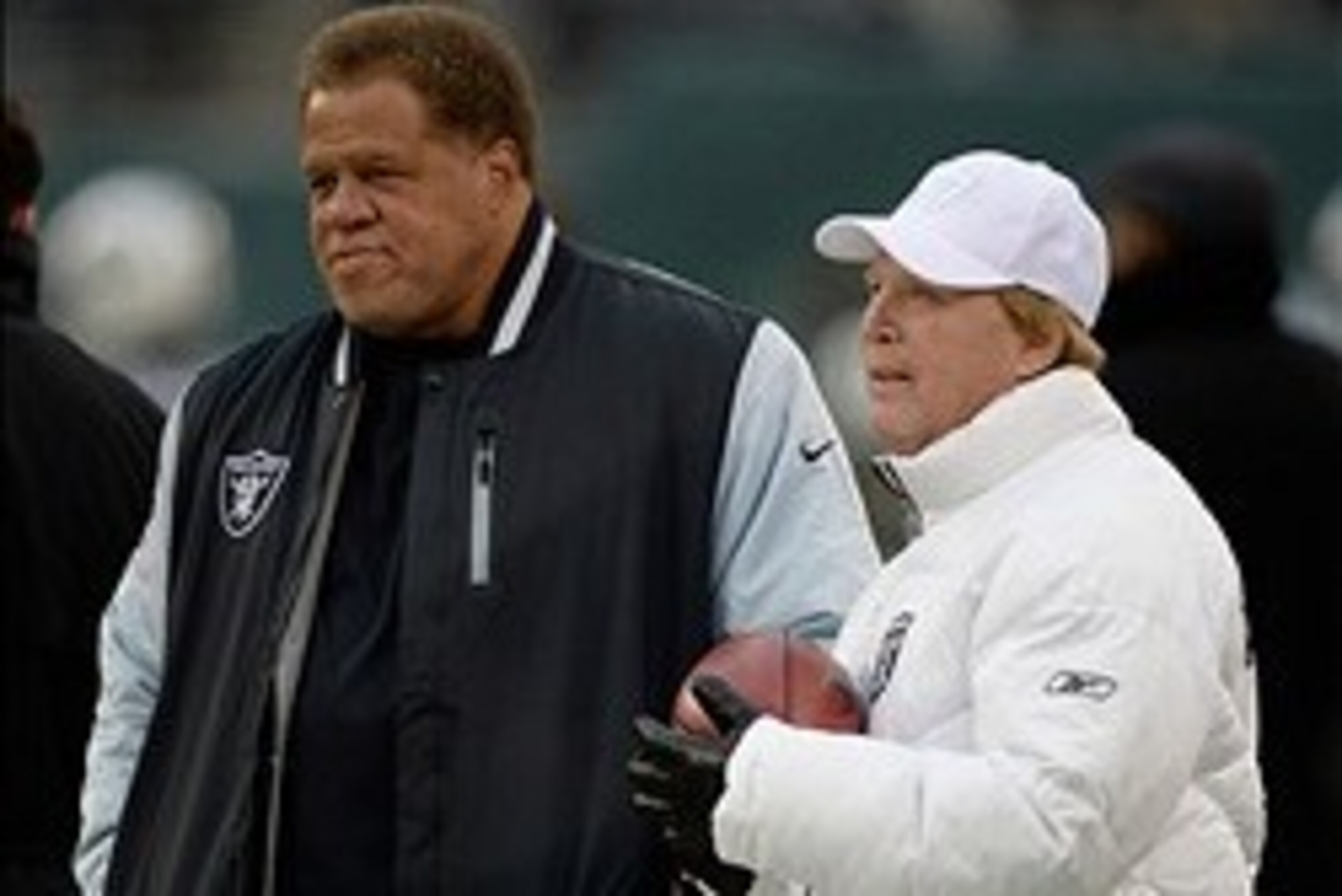 Dec 8, 2013; East Rutherford, NJ, USA; Oakland Raiders general manager Reggie McKenzie and owner Mark Davis on the field before the game against the New York Jets at MetLife Stadium. Mandatory Credit: Robert Deutsch-USA TODAY Sports
