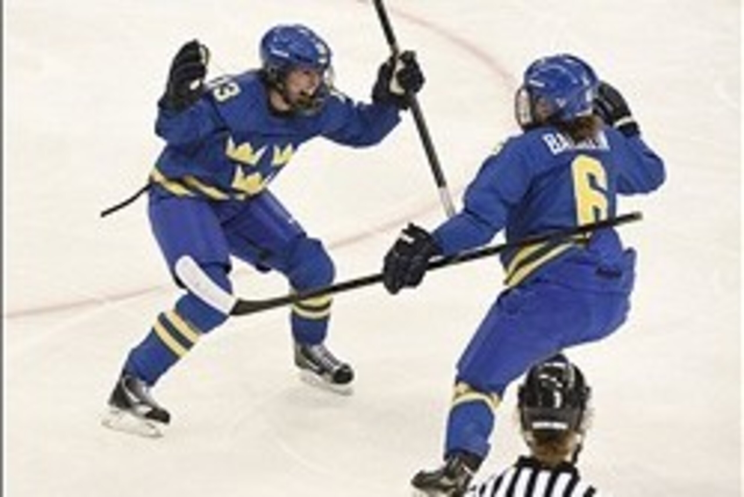 Feb 15, 2014; Sochi, RUSSIA; Sweden forward Lina Wester (13) celebrates her goal with Sweden defenseman Lina Backlin (6) against Finland in a women's quarterfinals ice hockey game during the Sochi 2014 Olympic Winter Games at Shayba Arena. Mandatory Credi