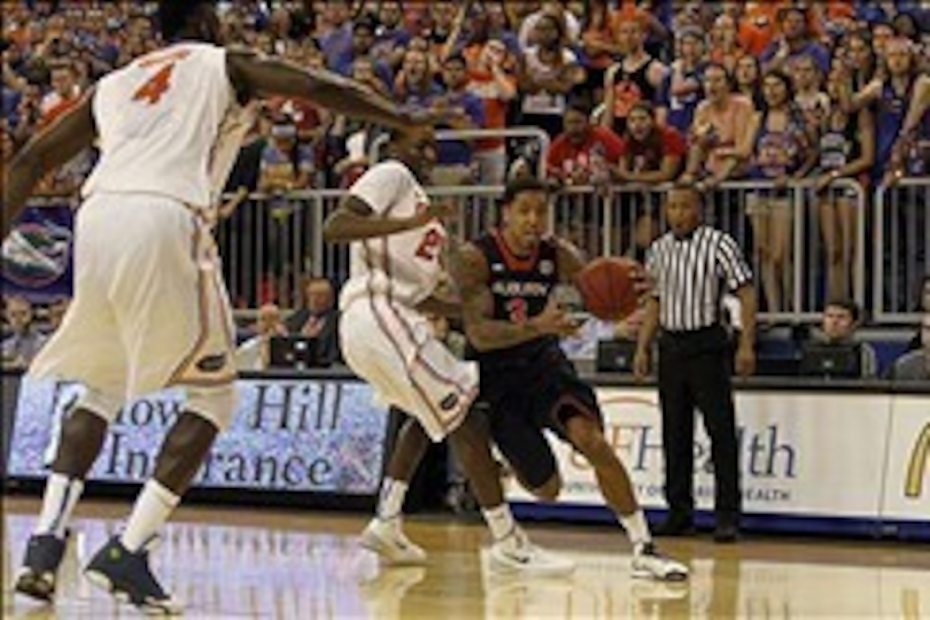 Feb 19, 2014; Gainesville, FL, USA; Auburn Tigers guard Chris Denson (3) drives to the basket as Florida Gators guard/forward DeVon Walker (25) defends during the first half at Stephen C. O'Connell Center. Mandatory Credit: Kim Klement-USA TODAY Sports