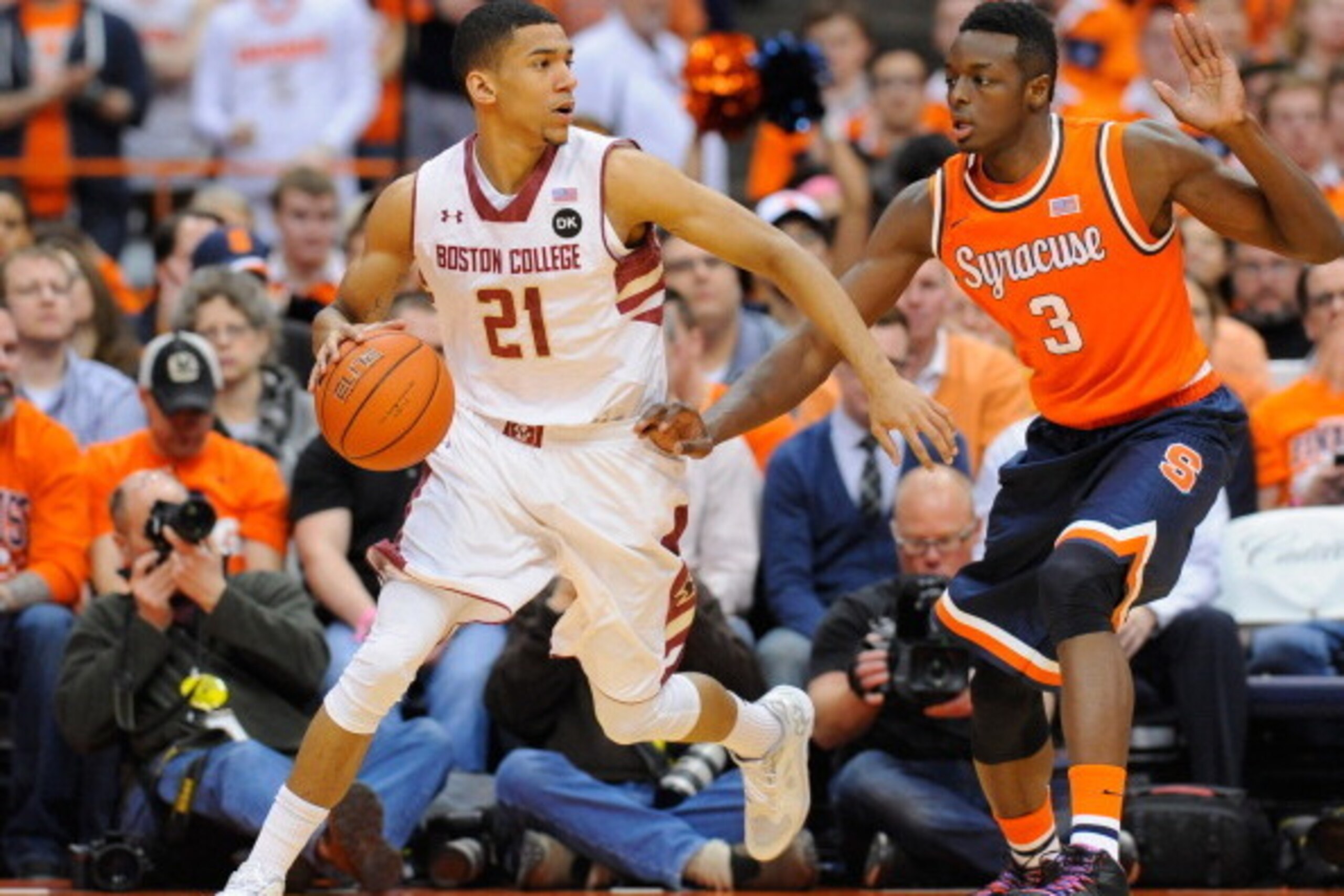 SYRACUSE, NY - FEBRUARY 19:  Olivier Hanlan #21 of the Boston College Eagles controls the ball against the defense of Jerami Grant #3 of the Syracuse Orange during the first half at the Carrier Dome on February 19, 2014 in Syracuse, New York.  (Photo by R