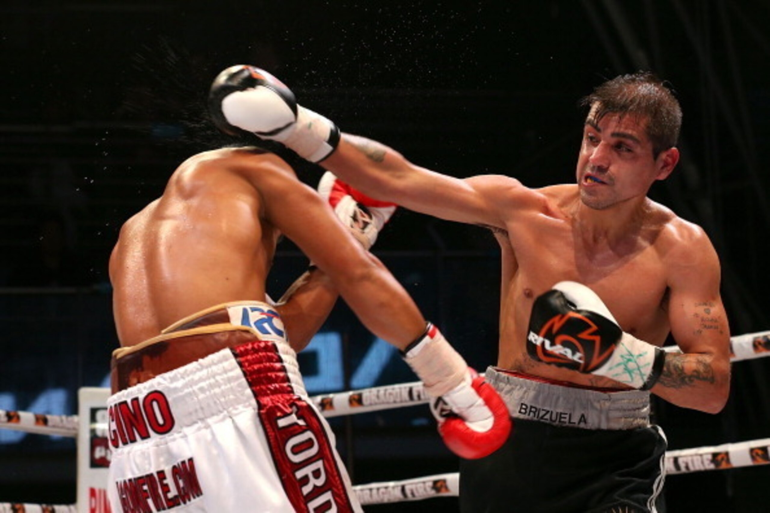 PERTH, AUSTRALIA - JULY 06:  Daud Yordan of Indonesia and Daniel Eduardo Brizuela of Argentina fight during the IBO World Lightweight Title bout at Metro City on July 6, 2013 in Perth, Australia.  (Photo by Paul Kane/Getty Images)