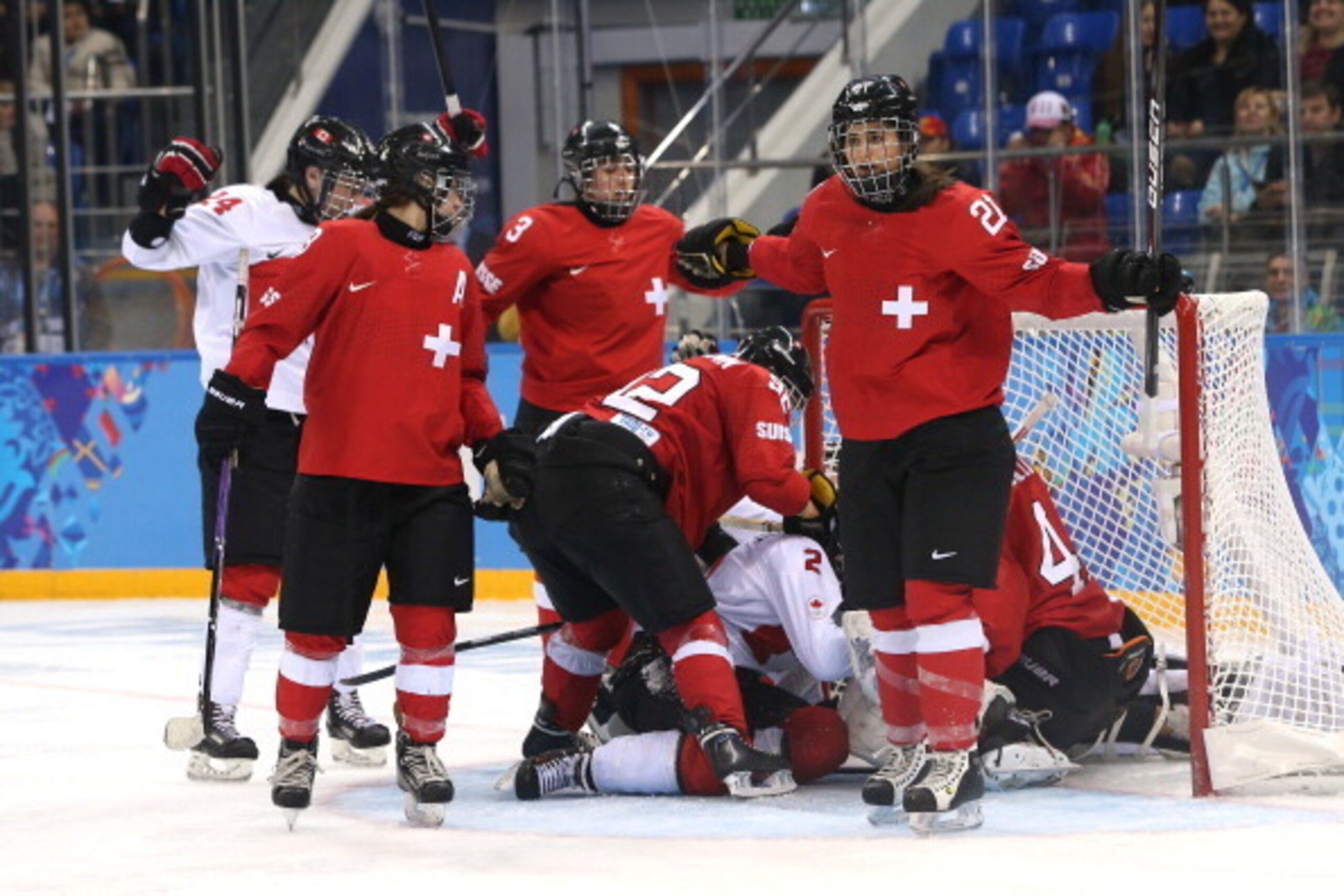 SOCHI, RUSSIA - FEBRUARY 17:  Laura Benz #21 of Switzerland and teammates react after a disallowed goal against Canada during the Women's Ice Hockey Playoffs Semifinal game on day ten of the Sochi 2014 Winter Olympics at Shayba Arena on February 17, 2014 