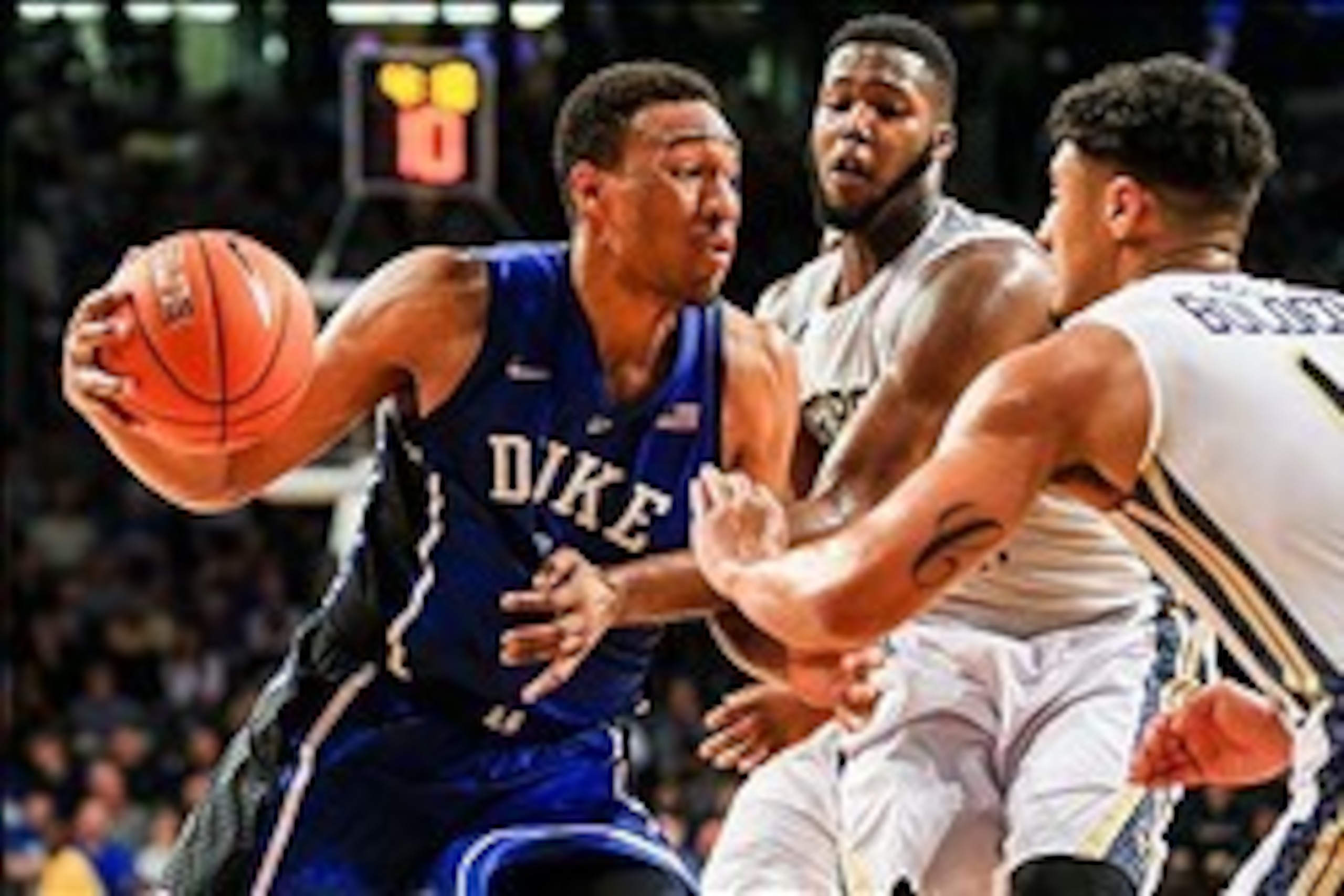 Feb 18, 2014; Atlanta, GA, USA; Duke Blue Devils forward Jabari Parker (1) drives to the basket against Georgia Tech Yellow Jackets forward Robert Carter, Jr. (4) and guard Chris Bolden (11) in the second half at Hank McCamish Pavilion. Duke won 68-51. Ma