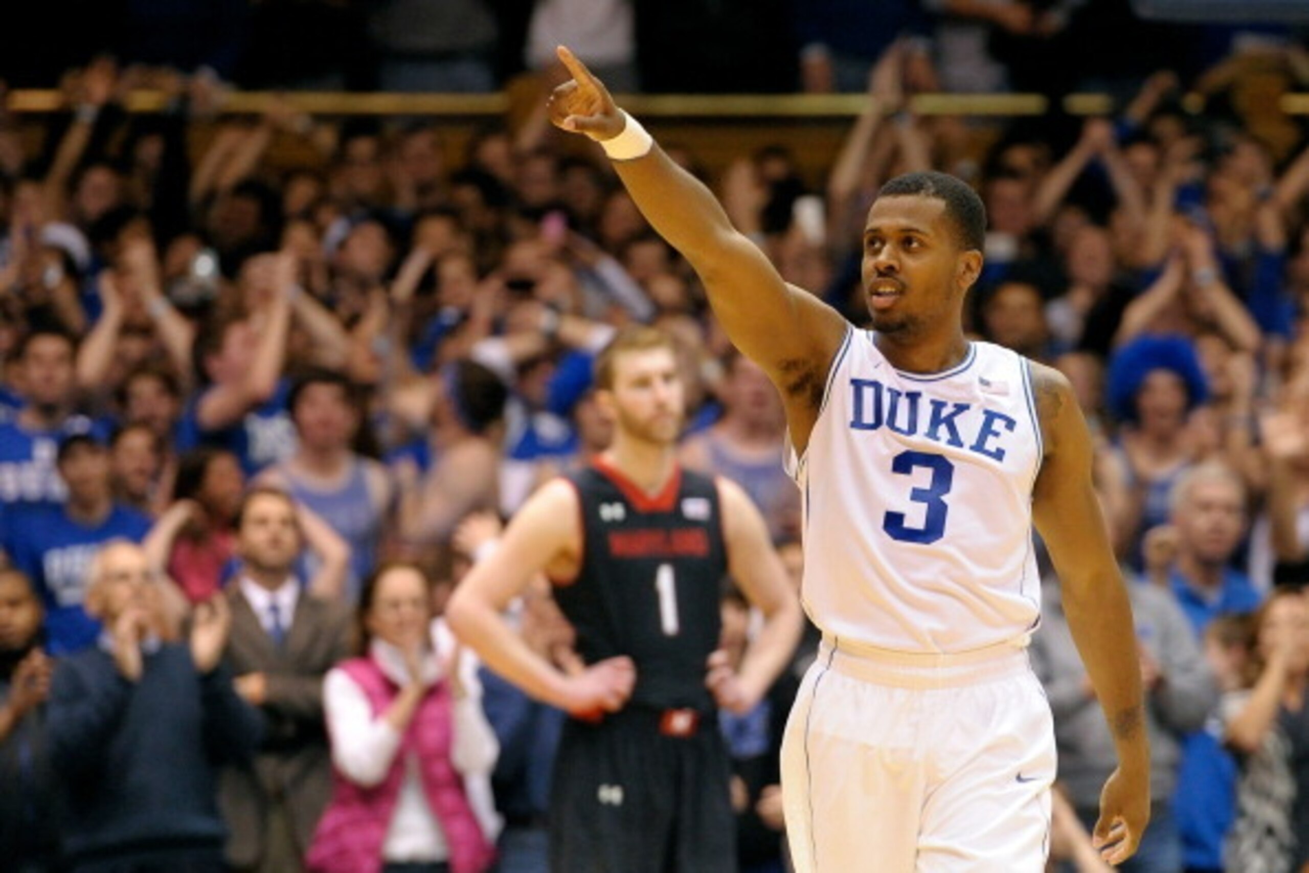 DURHAM, NC - FEBRUARY 15:  Tyler Thornton #3 of the Duke Blue Devils salutes the fans after a win over the Maryland Terrapins during their game at Cameron Indoor Stadium on February 15, 2014 in Durham, North Carolina. Duke won 69-67.  (Photo by Grant Halv