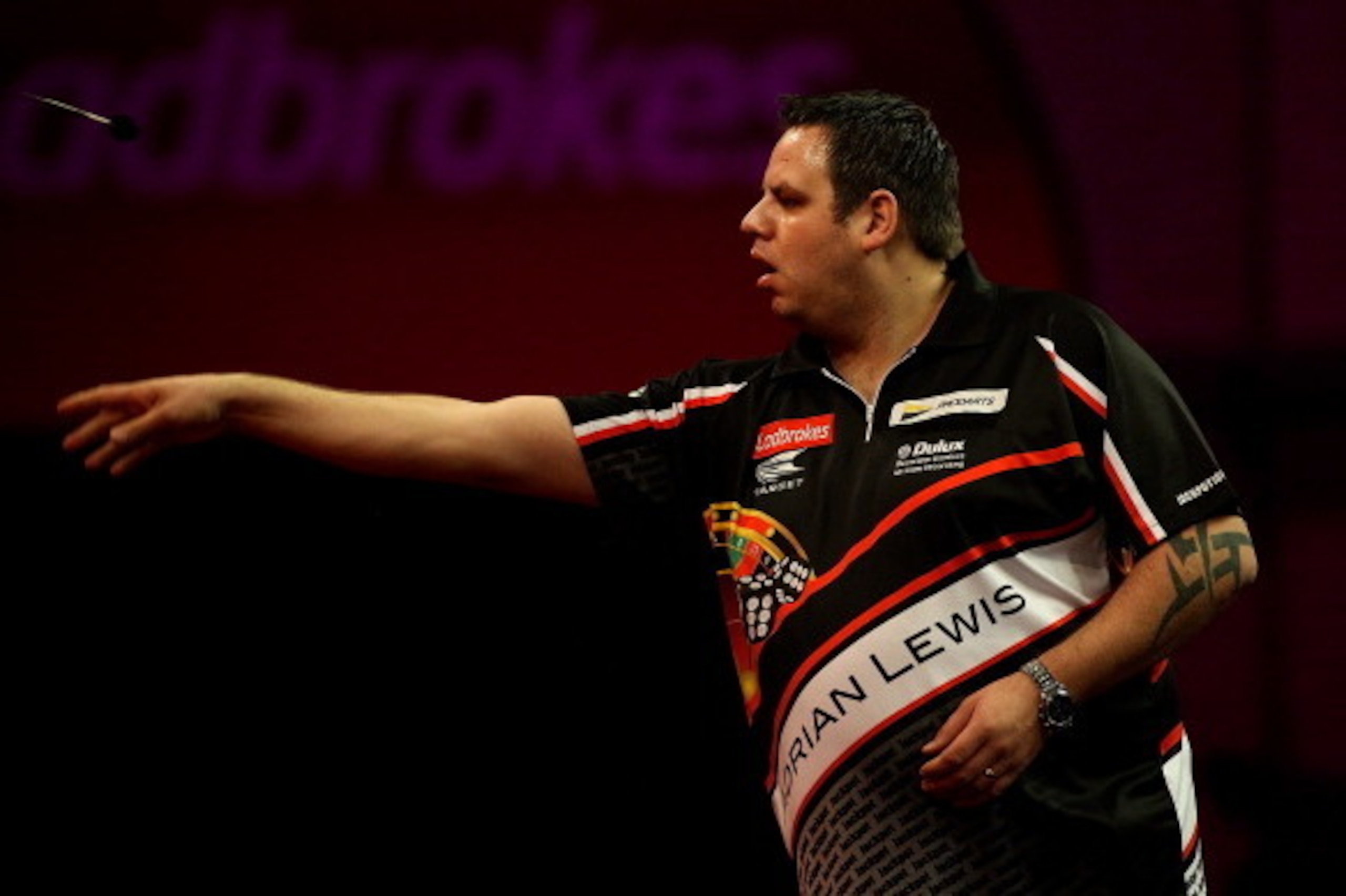 LONDON, ENGLAND - DECEMBER 29: Adrian Lewis of England in action during his quarter final match against James Wade of England on day fourteen of the Ladbrokes.com World Darts Championship at Alexandra Palace on December 29, 2013 in London, England. (Phot LONDON, ENGLAND - DECEMBER 29: Adrian Lewis of England in action during his quarter final match against James Wade of England on day fourteen of the Ladbrokes.com World Darts Championship at Alexandra Palace on December 29, 2013 in London, England. (Phot