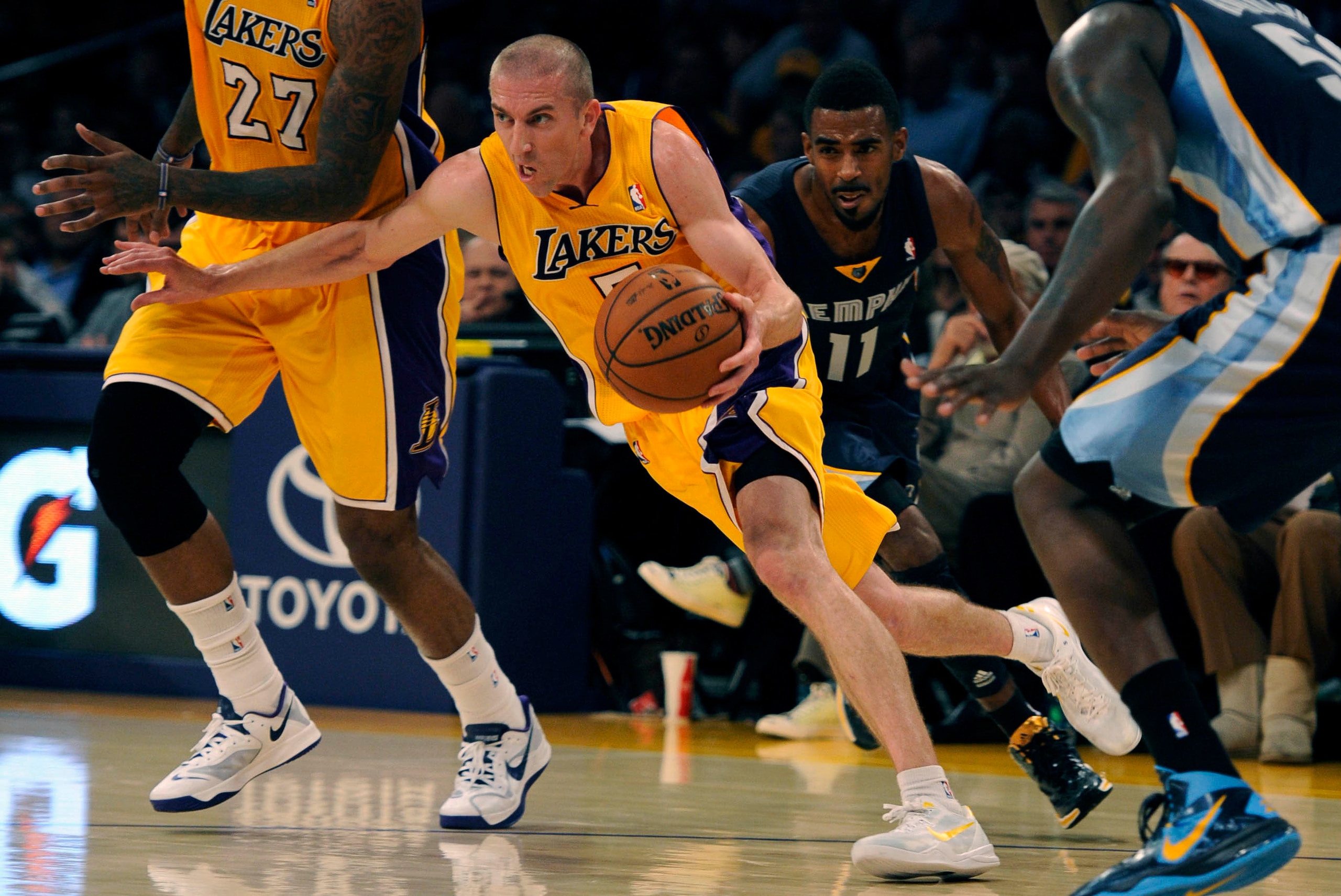 Nov 15, 2013; Los Angeles, CA, USA; Los Angeles Lakers guard Steve Blake (5) drives the ball against the Memphis Grizzlies during the third quarter at Staples Center. The Memphis Grizzlies defeated the Los Angeles Lakers 89-86. Mandatory Credit: Kelvin Ku