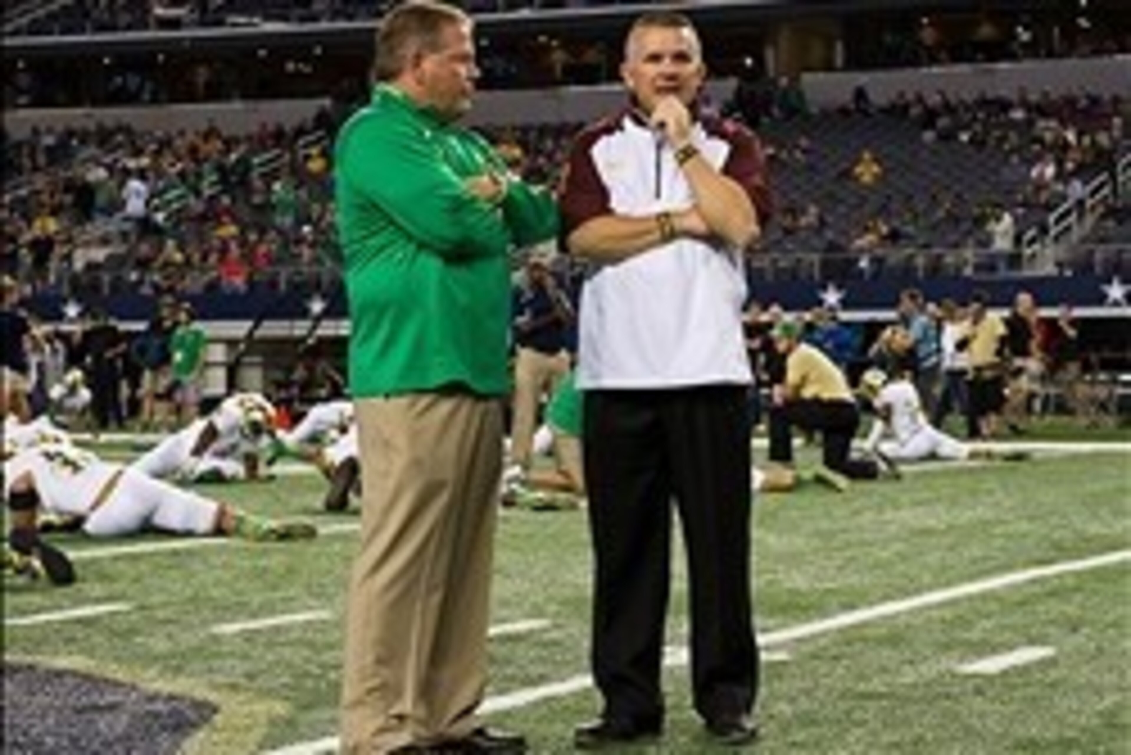 Oct 5, 2013; Arlington, TX, USA; Notre Dame Fighting Irish head coach Brian Kelly and Arizona State Sun Devils head coach Todd Graham chat before the game at AT&T Stadium. Mandatory Credit: Matt Cashore-USA TODAY Sports