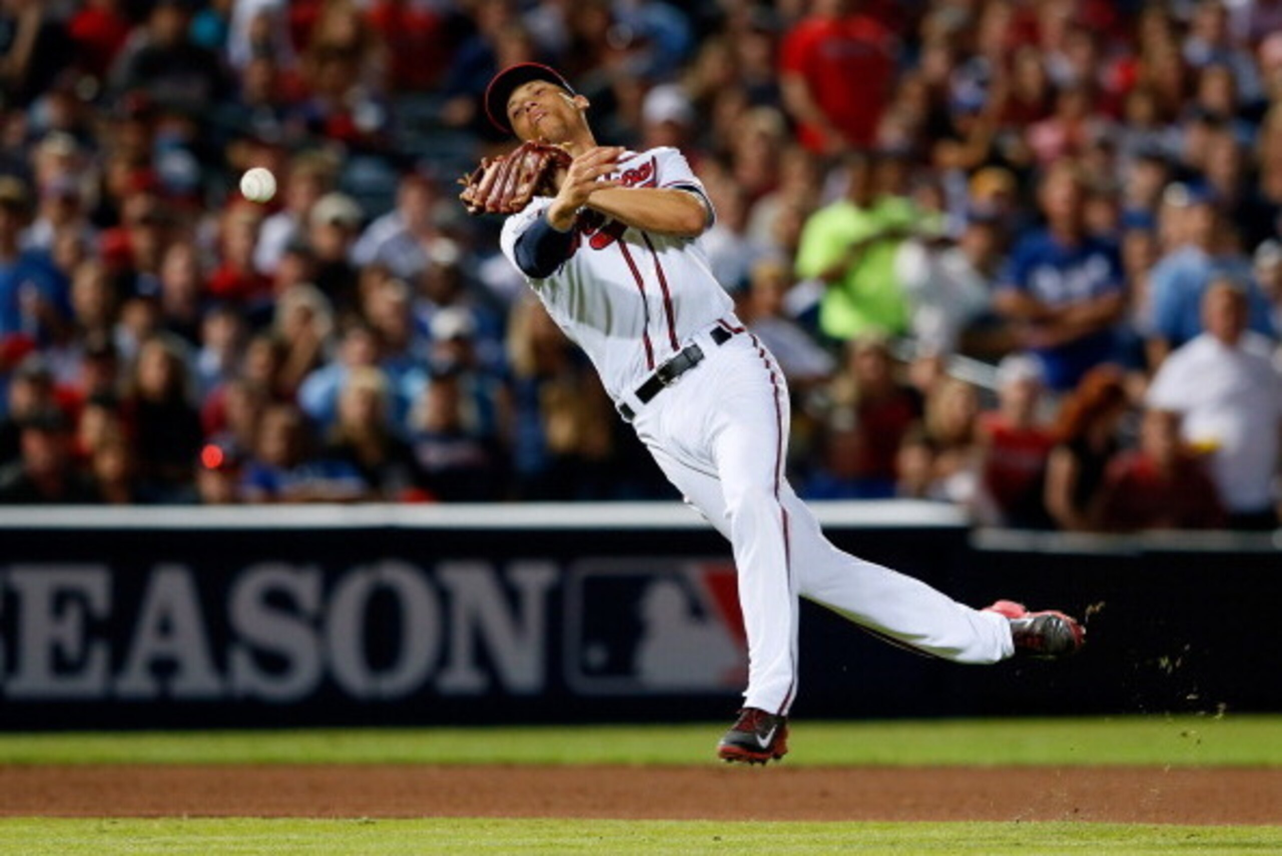 ATLANTA, GA - OCTOBER 04: Andrelton Simmons #19 of the Atlanta Braves throws to first in the seventh inning against the Los Angeles Dodgers during Game Two of the National League Division Series at Turner Field on October 4, 2013 in Atlanta, Georgia.  (Ph