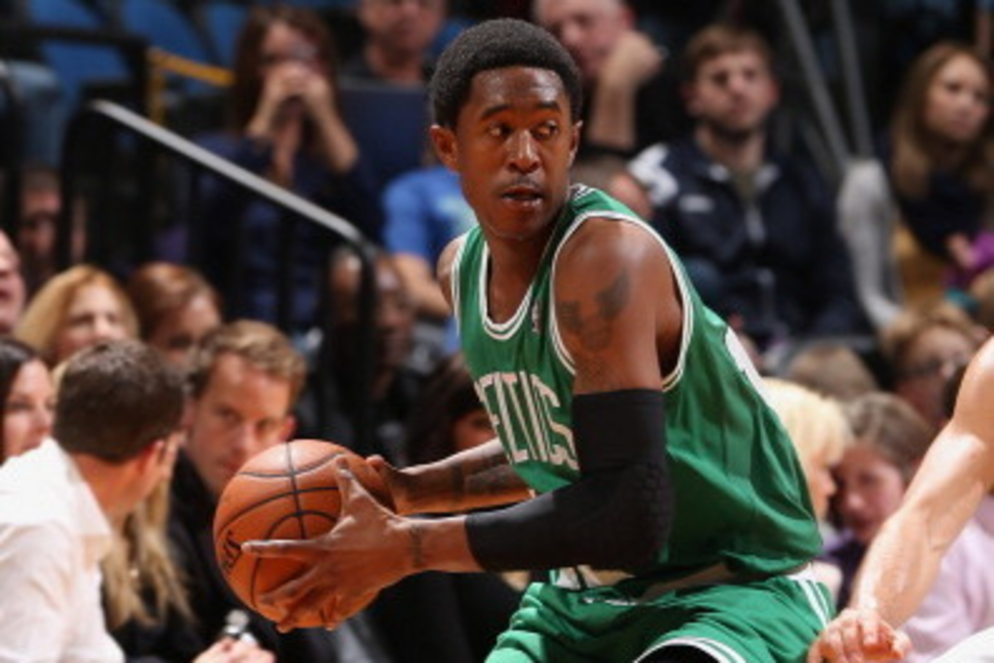 MINNEAPOLIS, MN - NOVEMBER 16: MarShon Brooks #12 of the Boston Celtics passes the ball against the Minnesota Timberwolves November 16, 2013 at Target Center in Minneapolis, Minnesota. NOTE TO USER: User expressly acknowledges and agrees that, by downlo MINNEAPOLIS, MN - NOVEMBER 16: MarShon Brooks #12 of the Boston Celtics passes the ball against the Minnesota Timberwolves November 16, 2013 at Target Center in Minneapolis, Minnesota. NOTE TO USER: User expressly acknowledges and agrees that, by downlo
