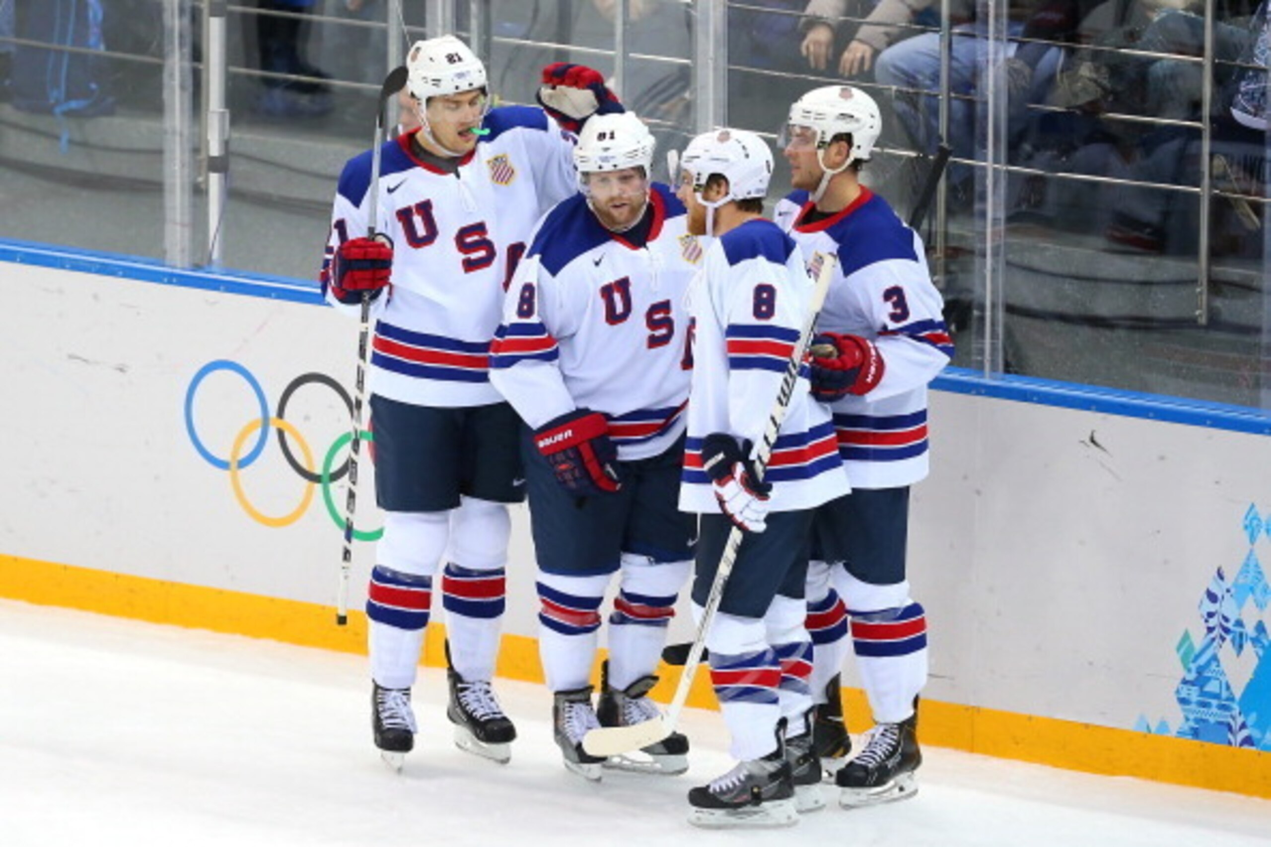 SOCHI, RUSSIA - FEBRUARY 16: Phil Kessel #81 of the United States celebrates his third goal with James van Riemsdyk #21, Joe Pavelski #8 and Cam Fowler #3 in the second period against Slovenia during the Men's Ice Hockey Preliminary Round Group A game on 