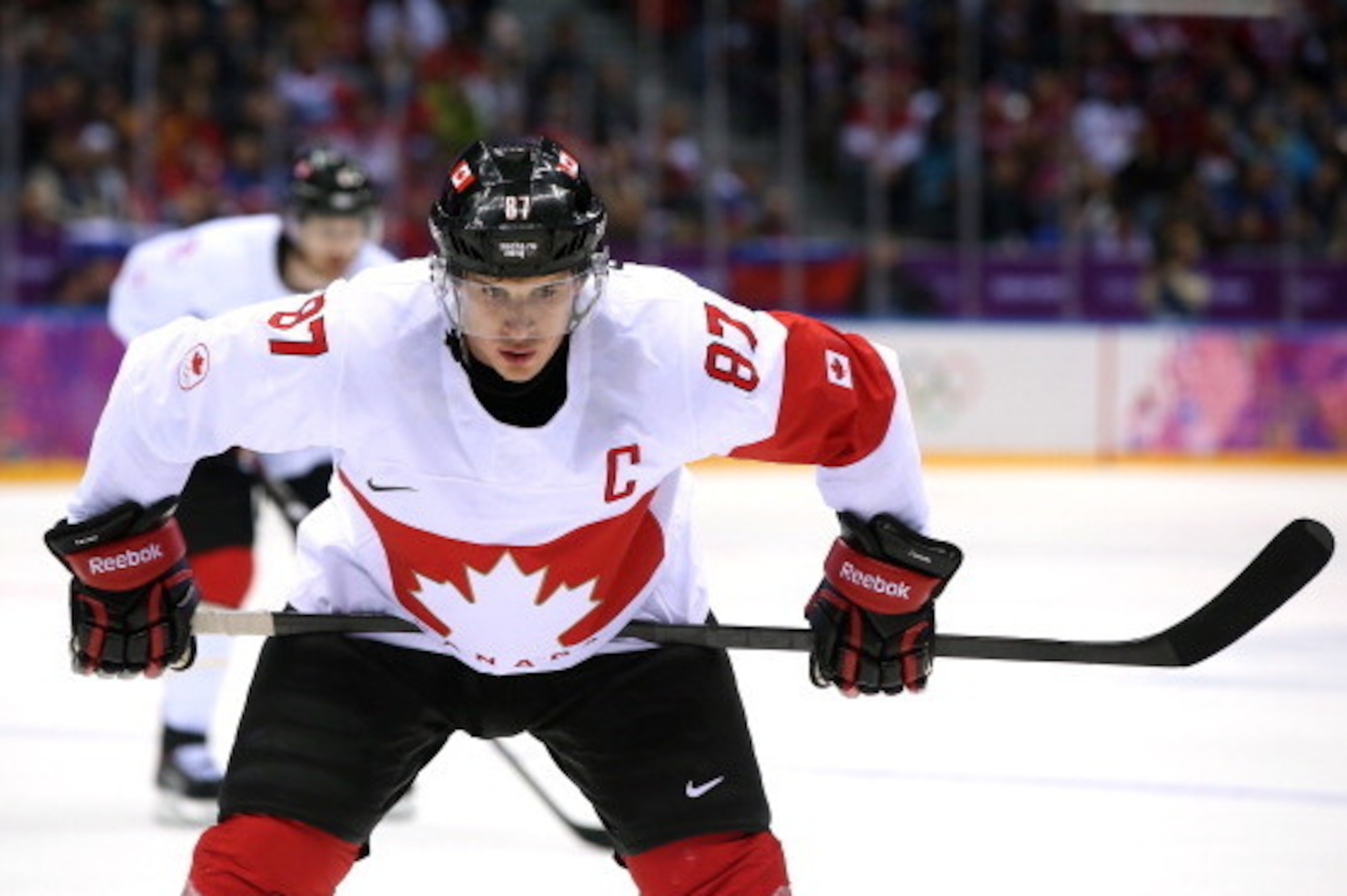 SOCHI, RUSSIA - FEBRUARY 19:  Sidney Crosby #87 of Canada looks on during the Men's Ice Hockey Quarterfinal Playoff against Latvia on Day 12 of the 2014 Sochi Winter Olympics at Bolshoy Ice Dome on February 19, 2014 in Sochi, Russia.  (Photo by Bruce Benn