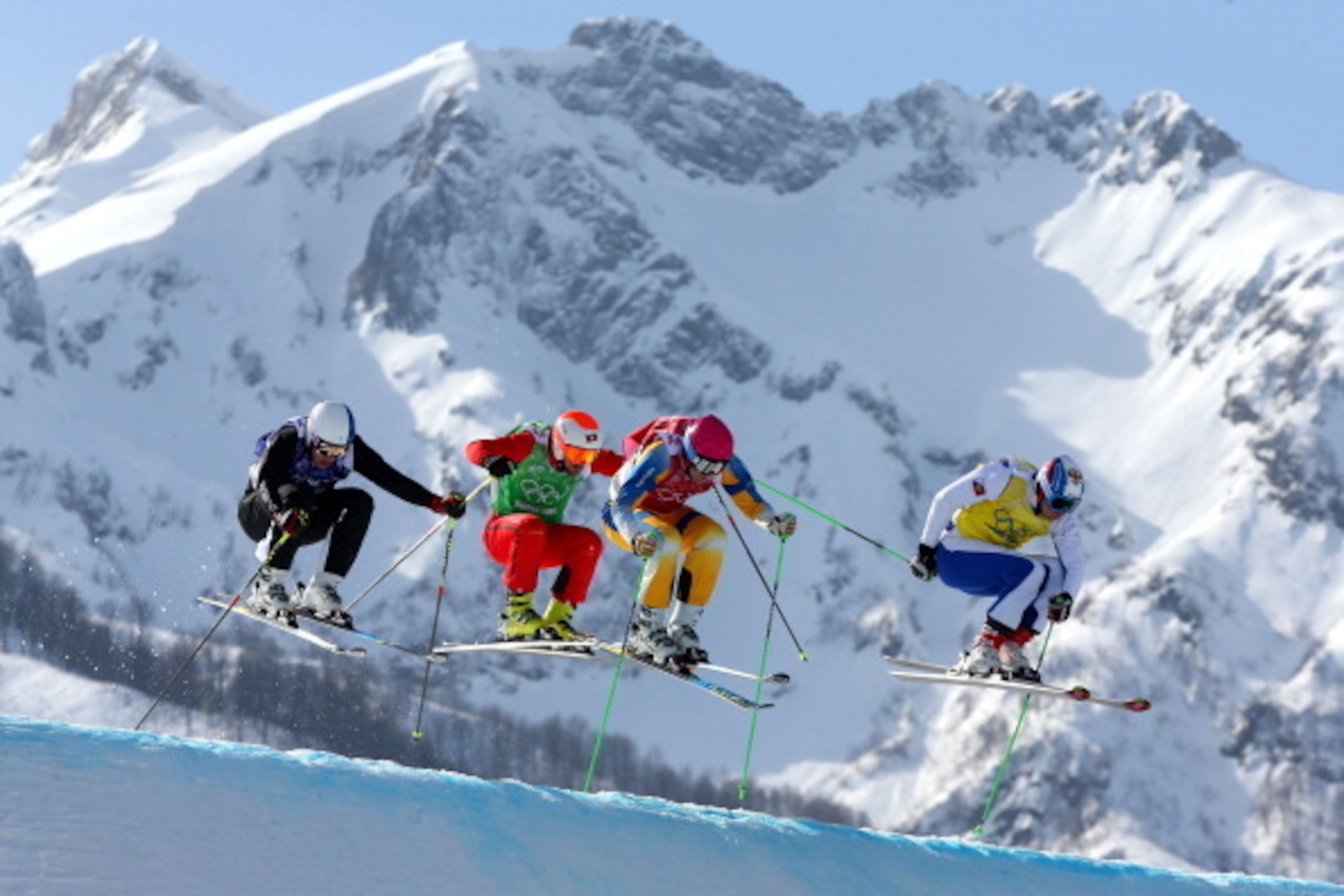 SOCHI, RUSSIA - FEBRUARY 20:  (L-R) Jouni Pellinen of Finland, Armin Niederer of Switzerland, Victor Oehling Norberg of Sweden and Egor Korotkov of Russia compete during the Freestyle Skiing Men's Ski Cross Quarter Finals on day 13 of the 2014 Sochi Winte