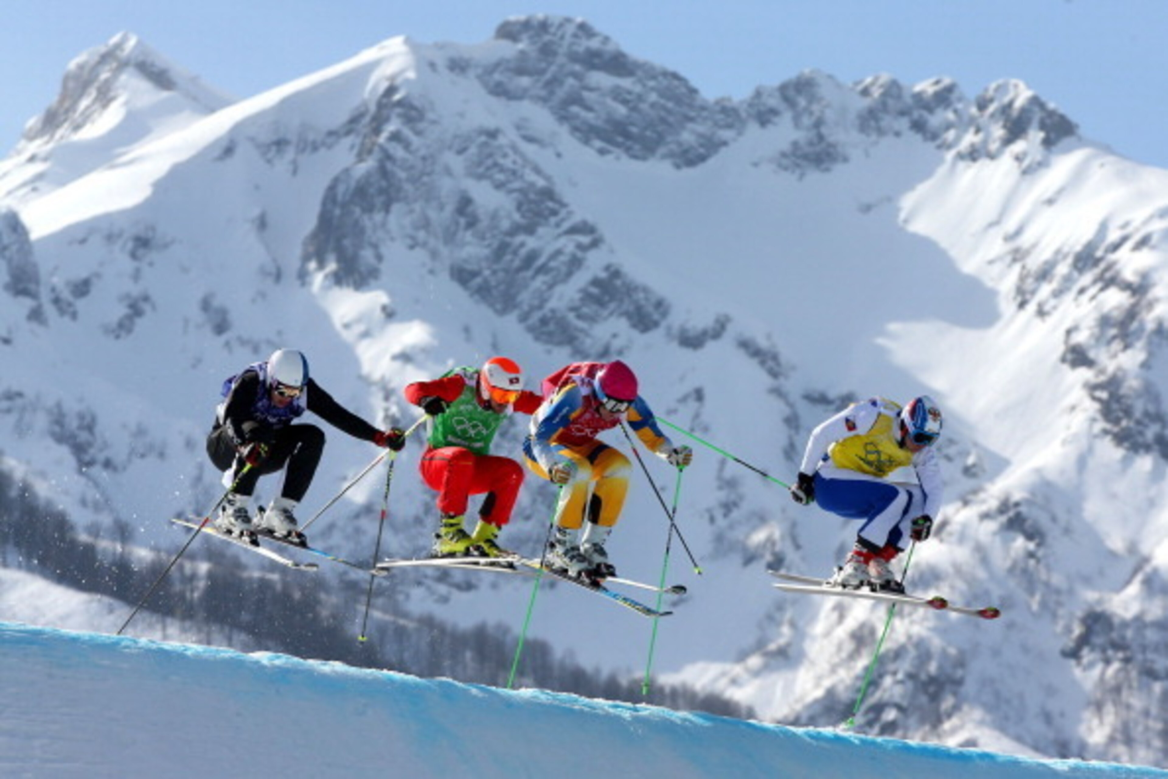 SOCHI, RUSSIA - FEBRUARY 20:  (L-R) Jouni Pellinen of Finland, Armin Niederer of Switzerland, Victor Oehling Norberg of Sweden and Egor Korotkov of Russia compete during the Freestyle Skiing Men's Ski Cross Quarter Finals on day 13 of the 2014 Sochi Winte
