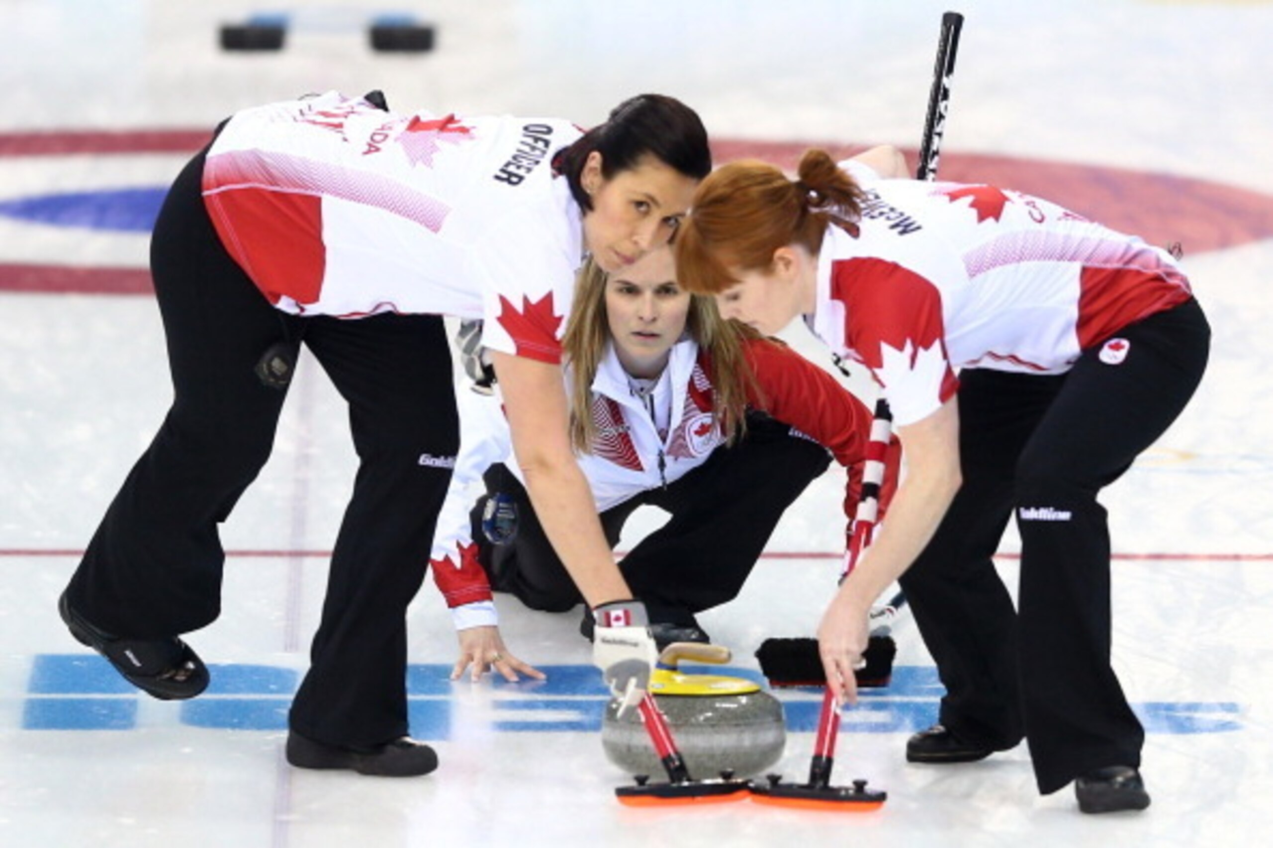 SOCHI, RUSSIA - FEBRUARY 19:  Jennifer Jones of Canada releases the stone during the women's semifinal match between Great Britain and Canada at Ice Cube Curling Center on February 19, 2014 in Sochi, Russia.  (Photo by Paul Gilham/Getty Images)