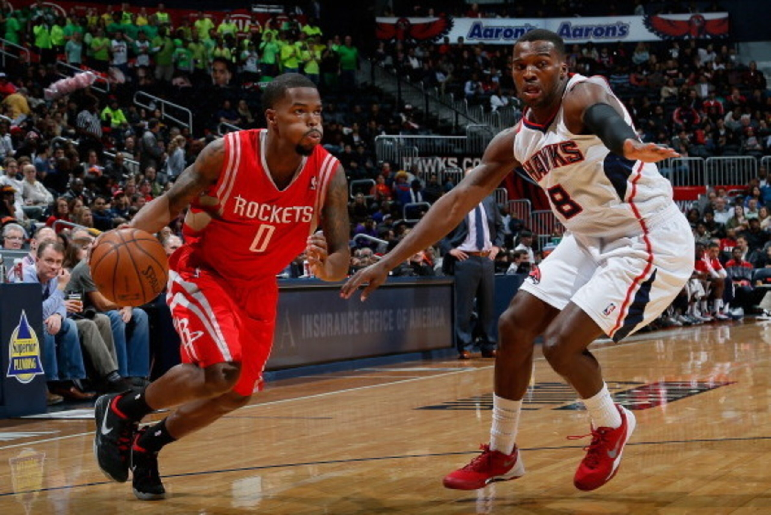 ATLANTA, GA - JANUARY 10: Aaron Brooks #0 of the Houston Rockets against Shelvin Mack #8 of the Atlanta Hawks at Philips Arena on January 10, 2014 in Atlanta, Georgia. NOTE TO USER: User expressly acknowledges and agrees that, by downloading and or usin ATLANTA, GA - JANUARY 10: Aaron Brooks #0 of the Houston Rockets against Shelvin Mack #8 of the Atlanta Hawks at Philips Arena on January 10, 2014 in Atlanta, Georgia. NOTE TO USER: User expressly acknowledges and agrees that, by downloading and or usin