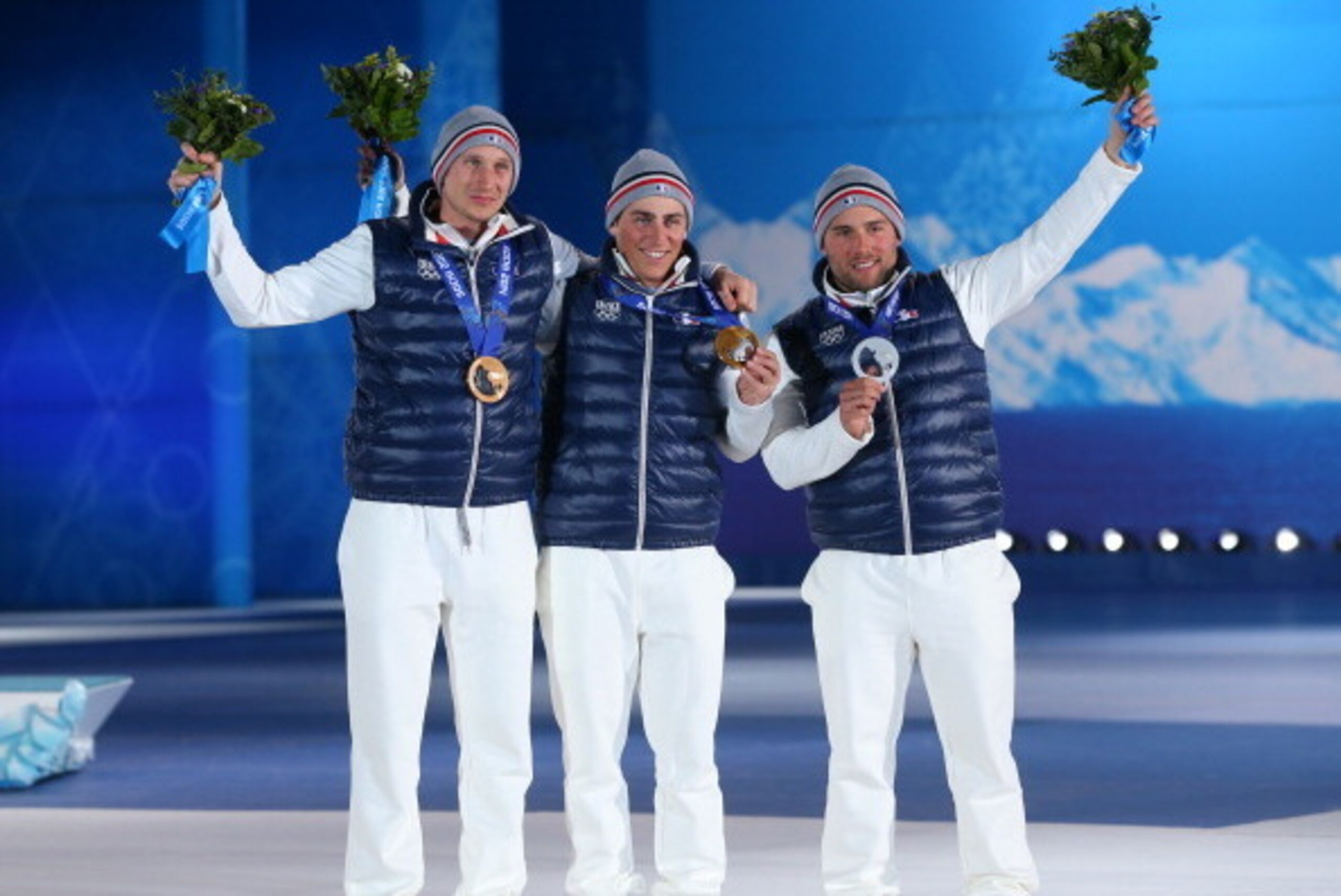 SOCHI, RUSSIA - FEBRUARY 20:  (L-R) Bronze medalist Jonathan Midol of France, gold medalist Jean Frederic Chapuis of France and Silver medalist Arnaud Bovolenta of France celebrate on the podium during the medal ceremony for the Freestyle Skiing Men's Ski
