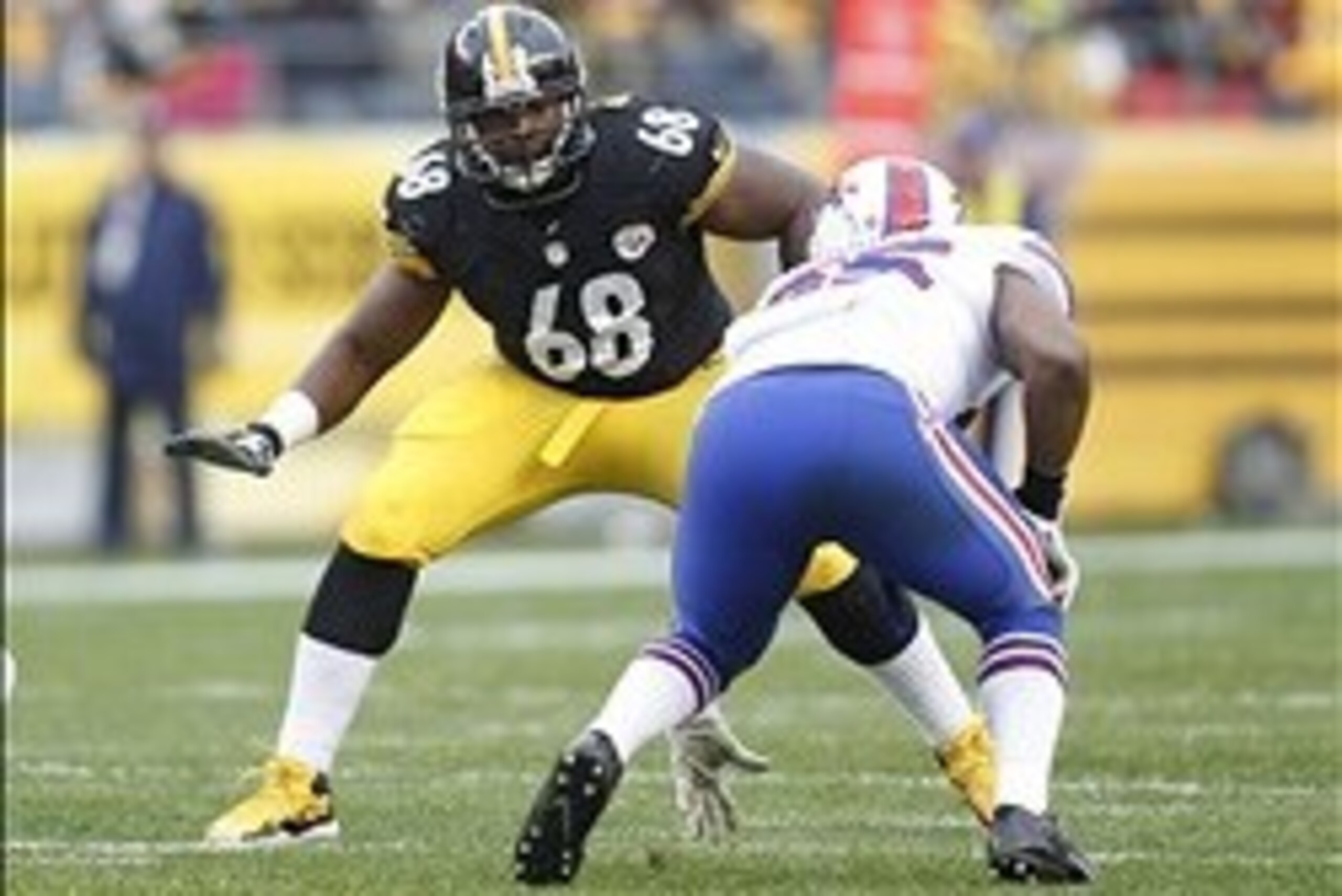 Nov 10, 2013; Pittsburgh, PA, USA; Pittsburgh Steelers tackle Kelvin Beachum (68) prepares to block against Buffalo Bills outside linebacker Jerry Hughes (right) during the second quarter at Heinz Field. The Steelers won 23-10. Mandatory Credit: Charles L