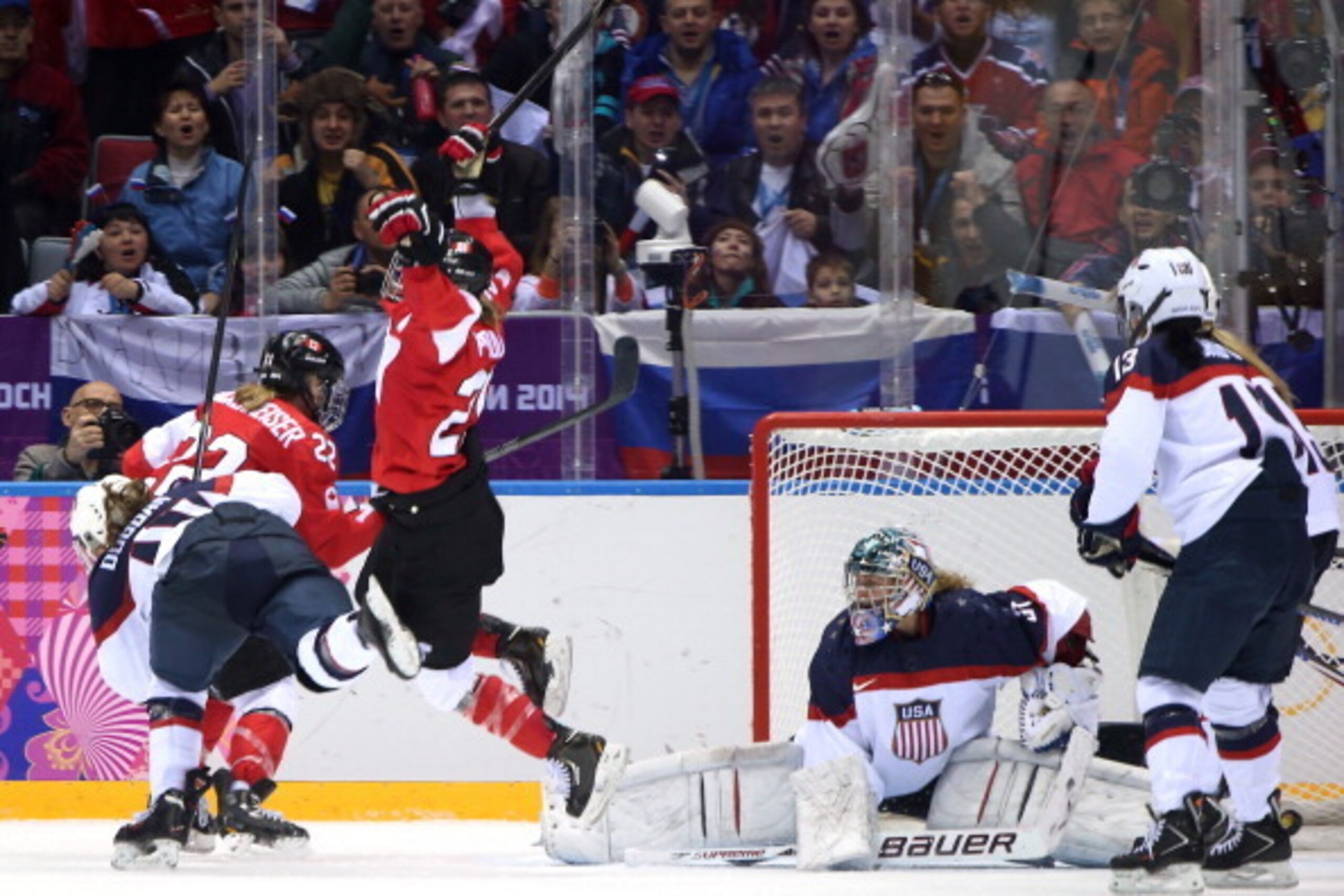 SOCHI, RUSSIA - FEBRUARY 20: Marie-Philip Poulin #29 of Canada celebrates after scoring the game winning goal in overtime against Jessie Vetter #31 of the United States during the Ice Hockey Women's Gold Medal Game on day 13 of the Sochi 2014 Winter Olymp