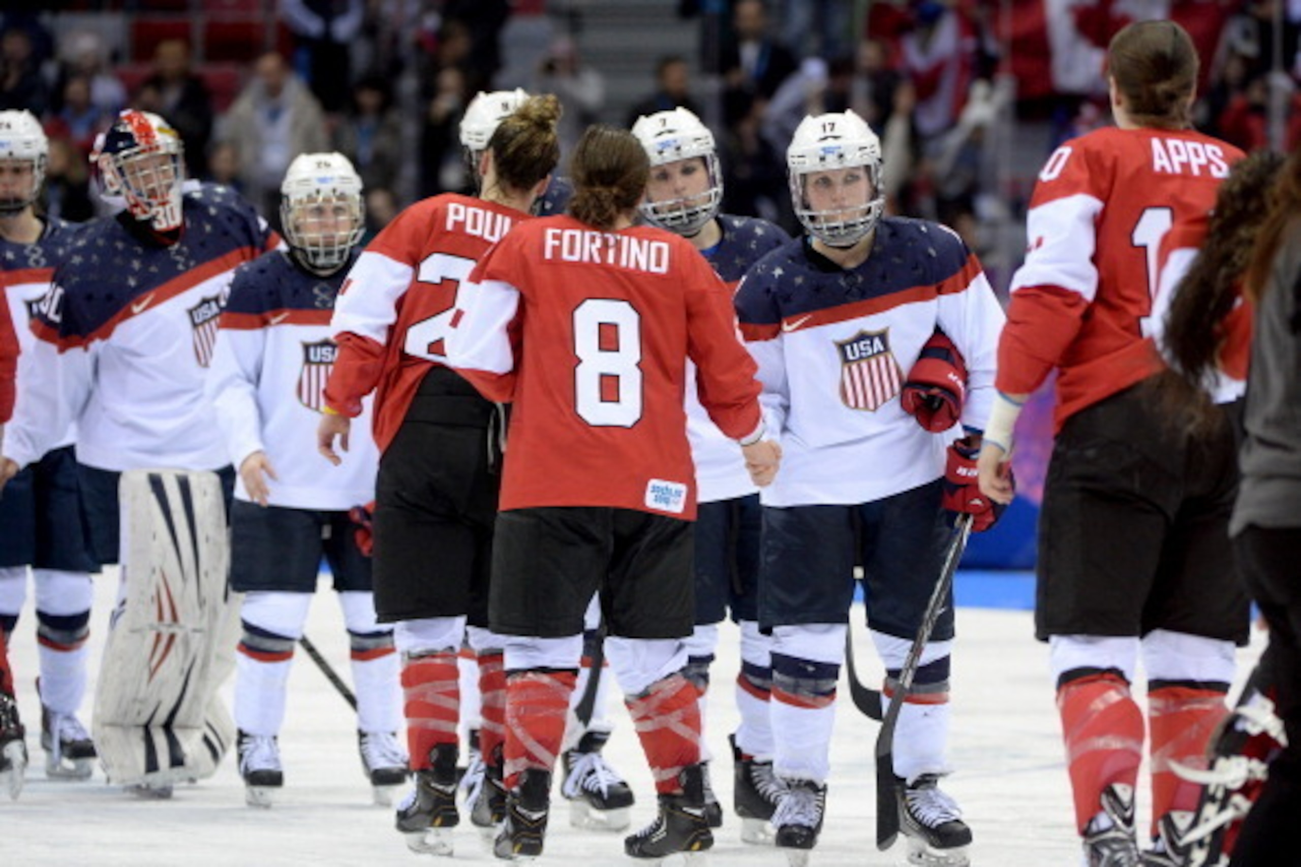 SOCHI, RUSSIA - FEBRUARY 20:  Canada and United States shake hands after Canada won3-2 in overtime during the Ice Hockey Women's Gold Medal Game on day 13 of the Sochi 2014 Winter Olympics at Bolshoy Ice Dome on February 20, 2014 in Sochi, Russia.  (Photo