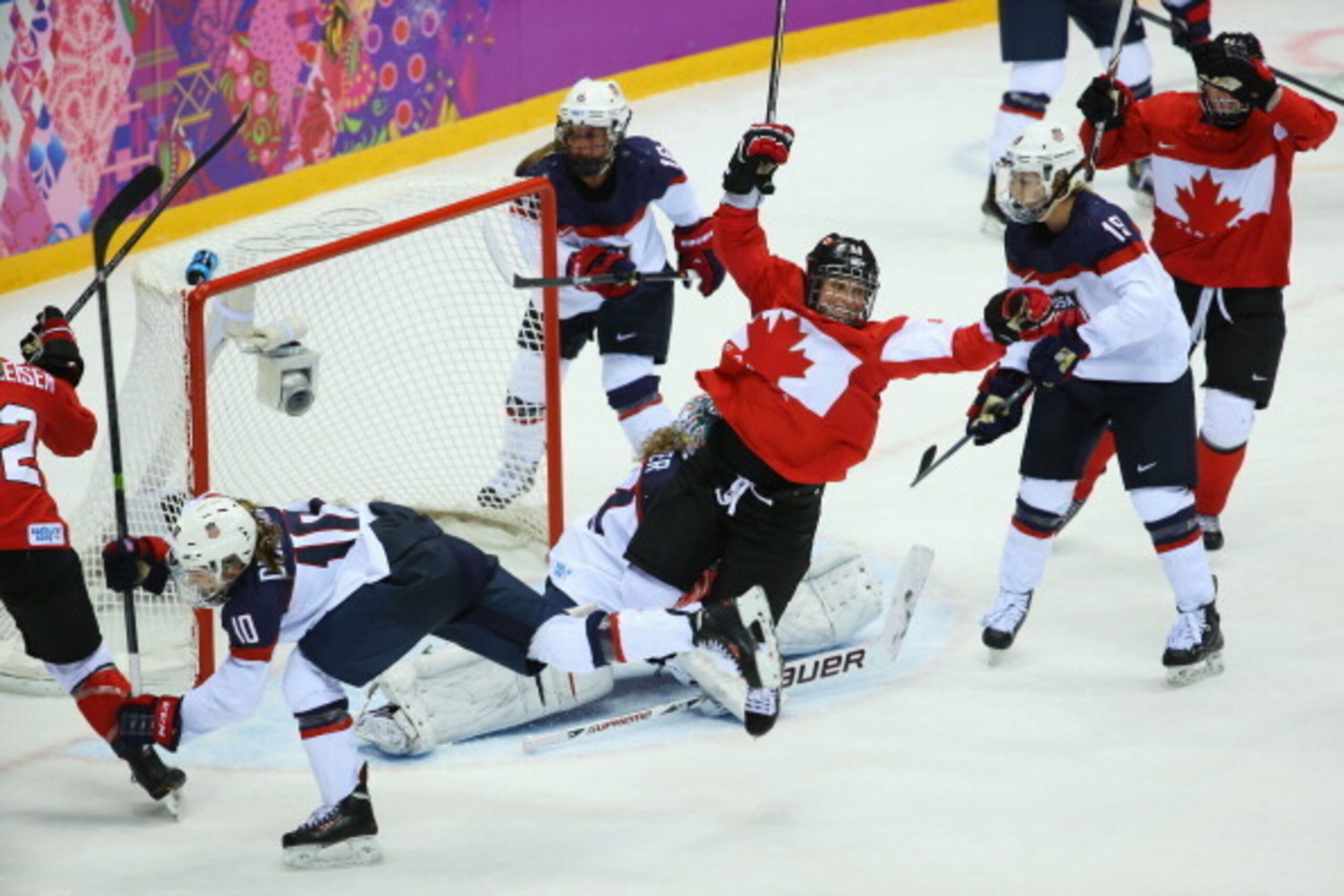 SOCHI, RUSSIA - FEBRUARY 20:  Marie-Philip Poulin #29 of Canada celebrates after scoring against Jessie Vetter #31 of the United States during the Ice Hockey Women's Gold Medal Game on day 13 of the Sochi 2014 Winter Olympics at Bolshoy Ice Dome on Februa